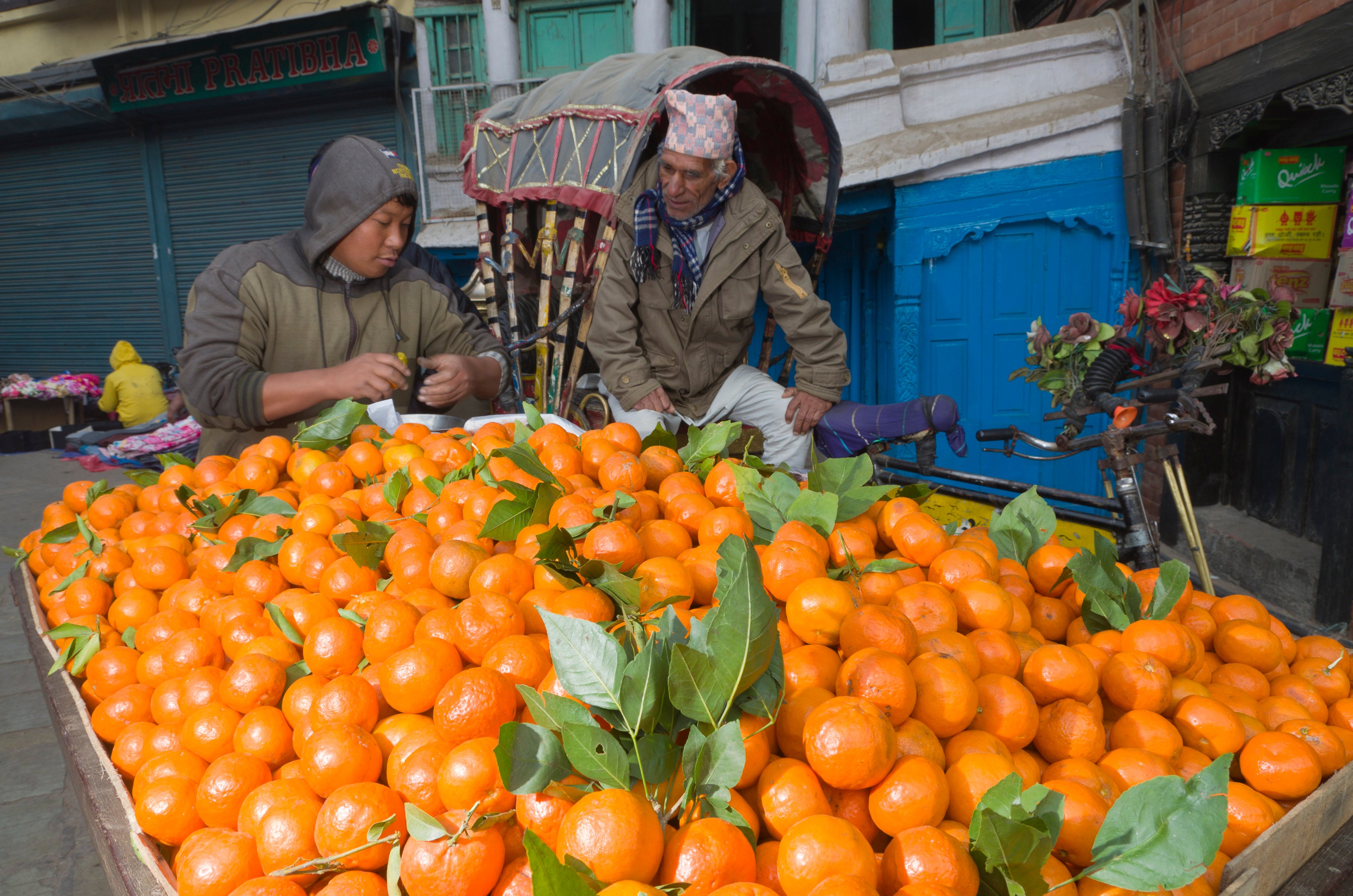 A street vendor sells oranges in Kathmandu, Nepal. Photo: Getty Images