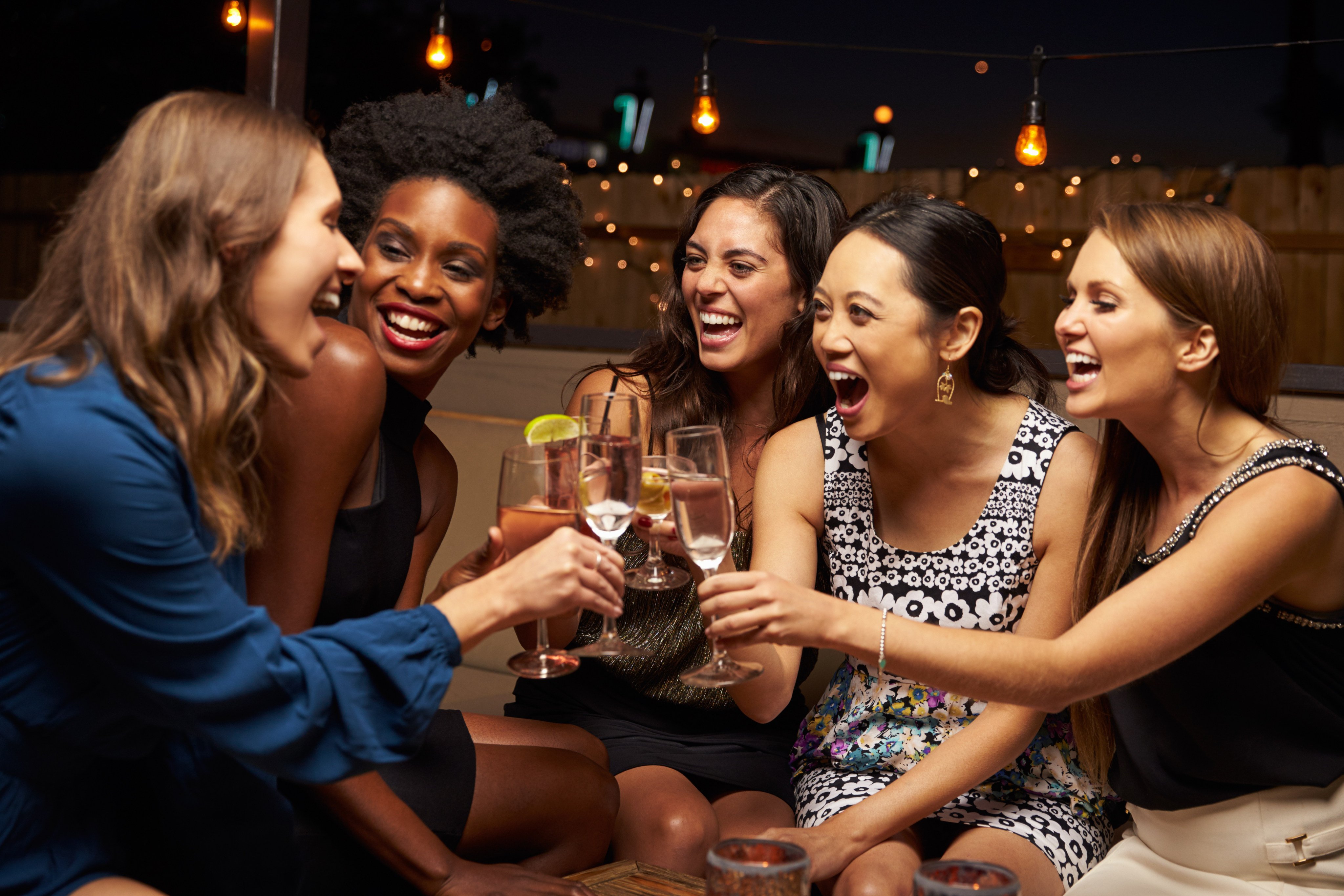 A group of women drinking. Sommelier Yulia Ezhikova shares five ways you can rethink your approach to alcohol and drinking, from no-alcohol days to keeping stress levels in check. Photo: Shutterstock