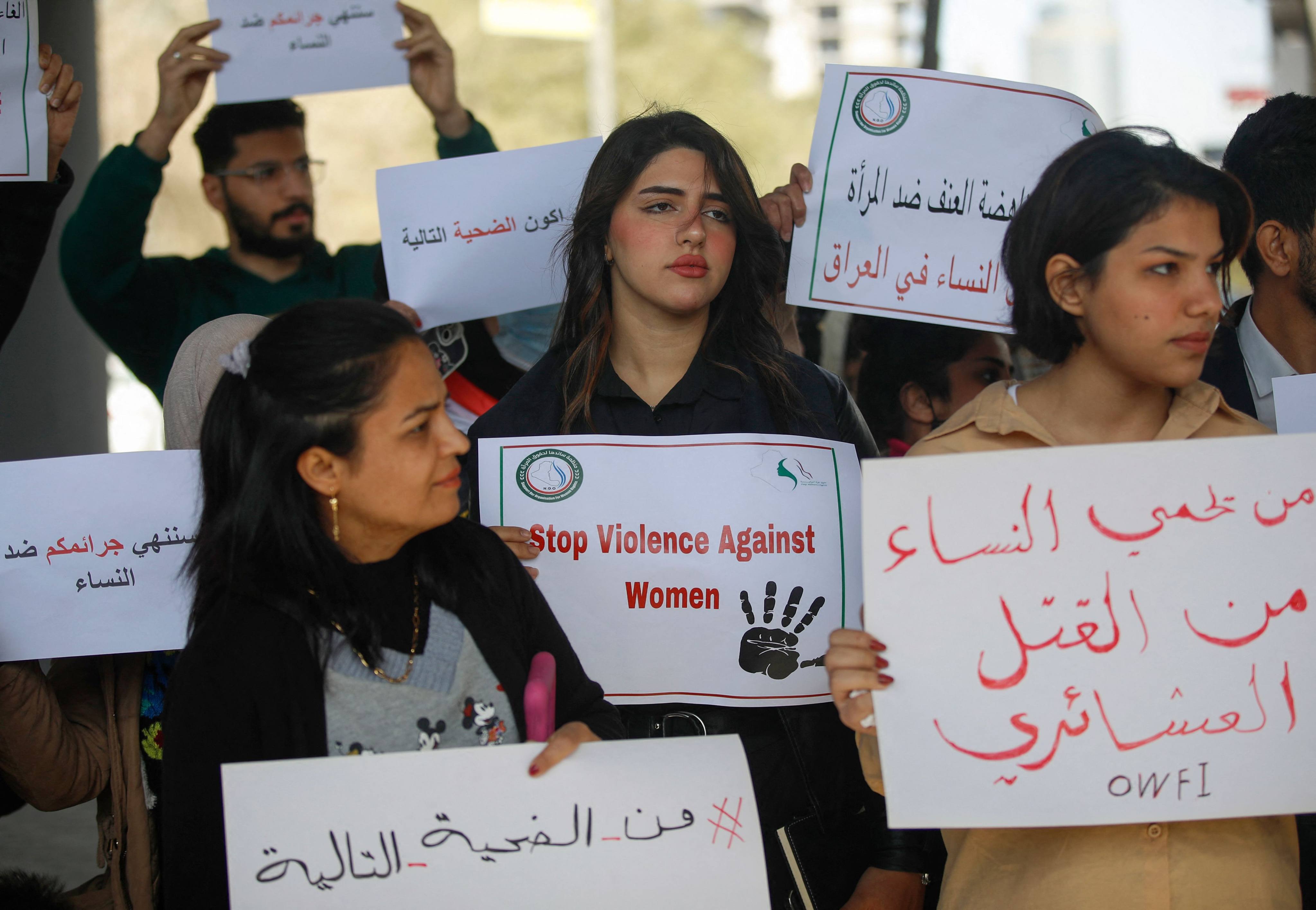 Iraqi women’s rights activists hold placards during a rally near the Supreme Judicial Council in Baghdad, Iraq on Sunday. Photo: AFP