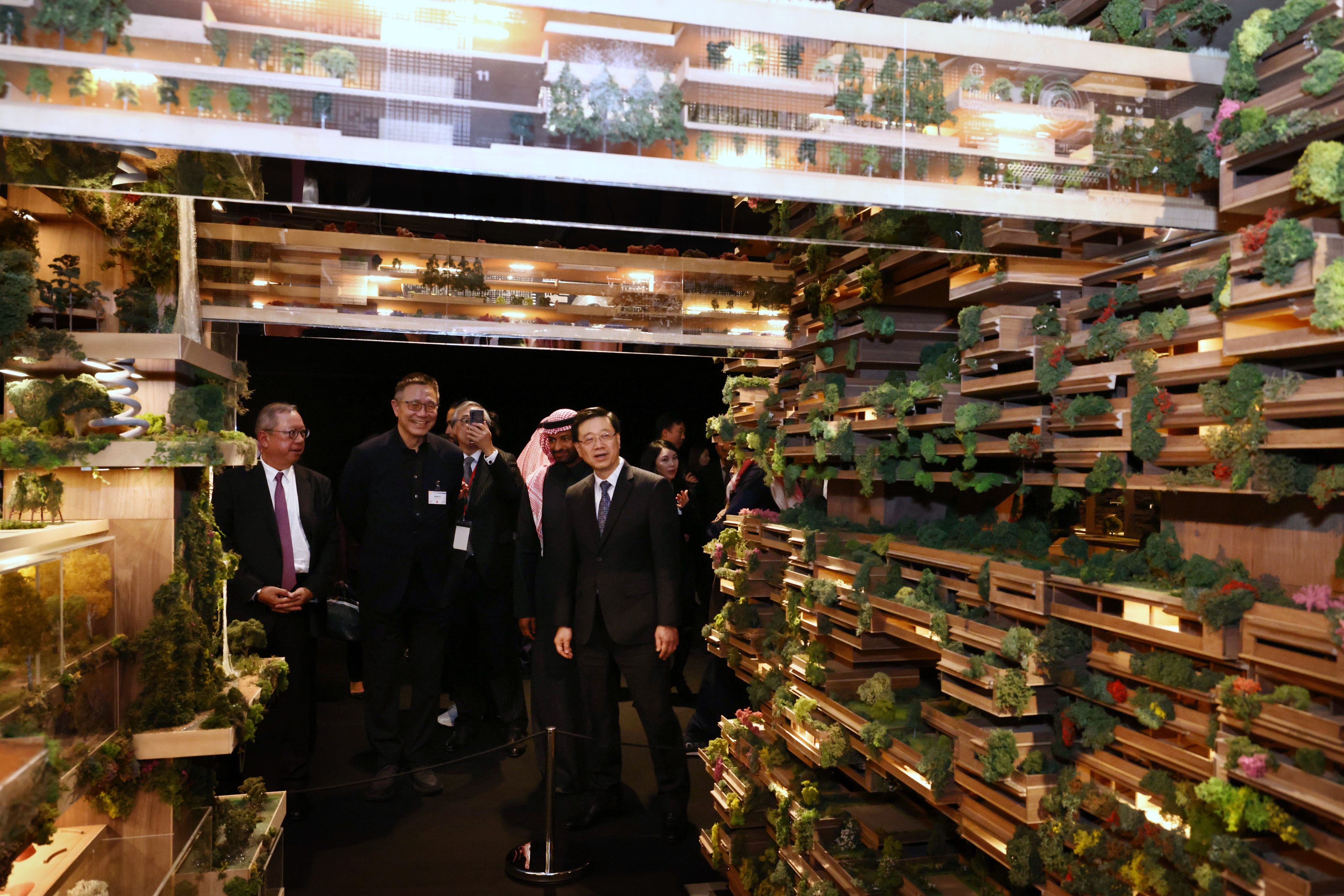 Chief Executive John Lee and members of the Hong Kong delegation get a tour of an exhibition in Riyadh on a smart city project. Photo: Handout