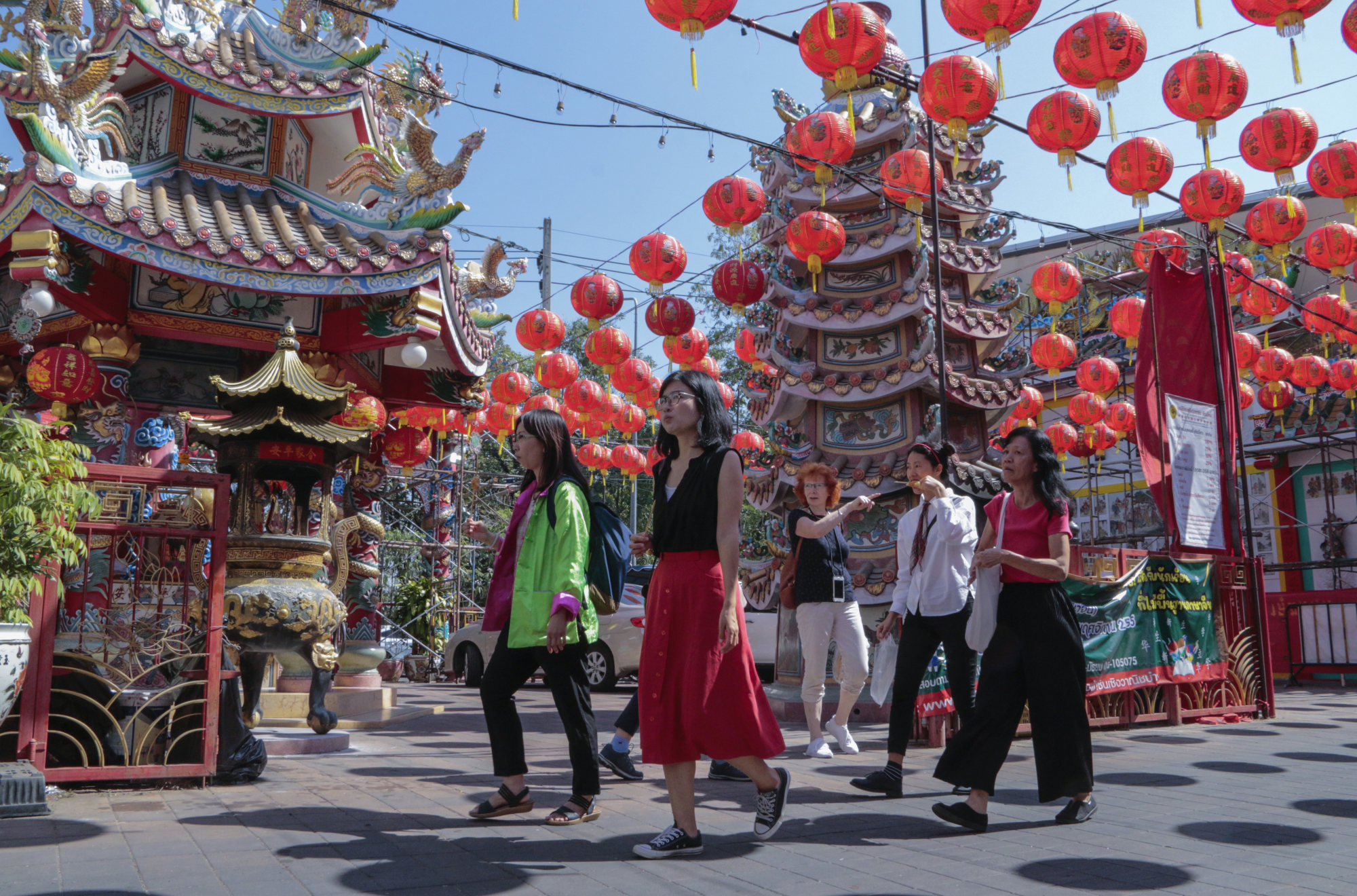 Tourists from China and elsewhere tour a temple in Thailand’s Chiang Mai province last month. Economists say the return of Chinese tourists is likely to buttress Asian economies. Photo: AP