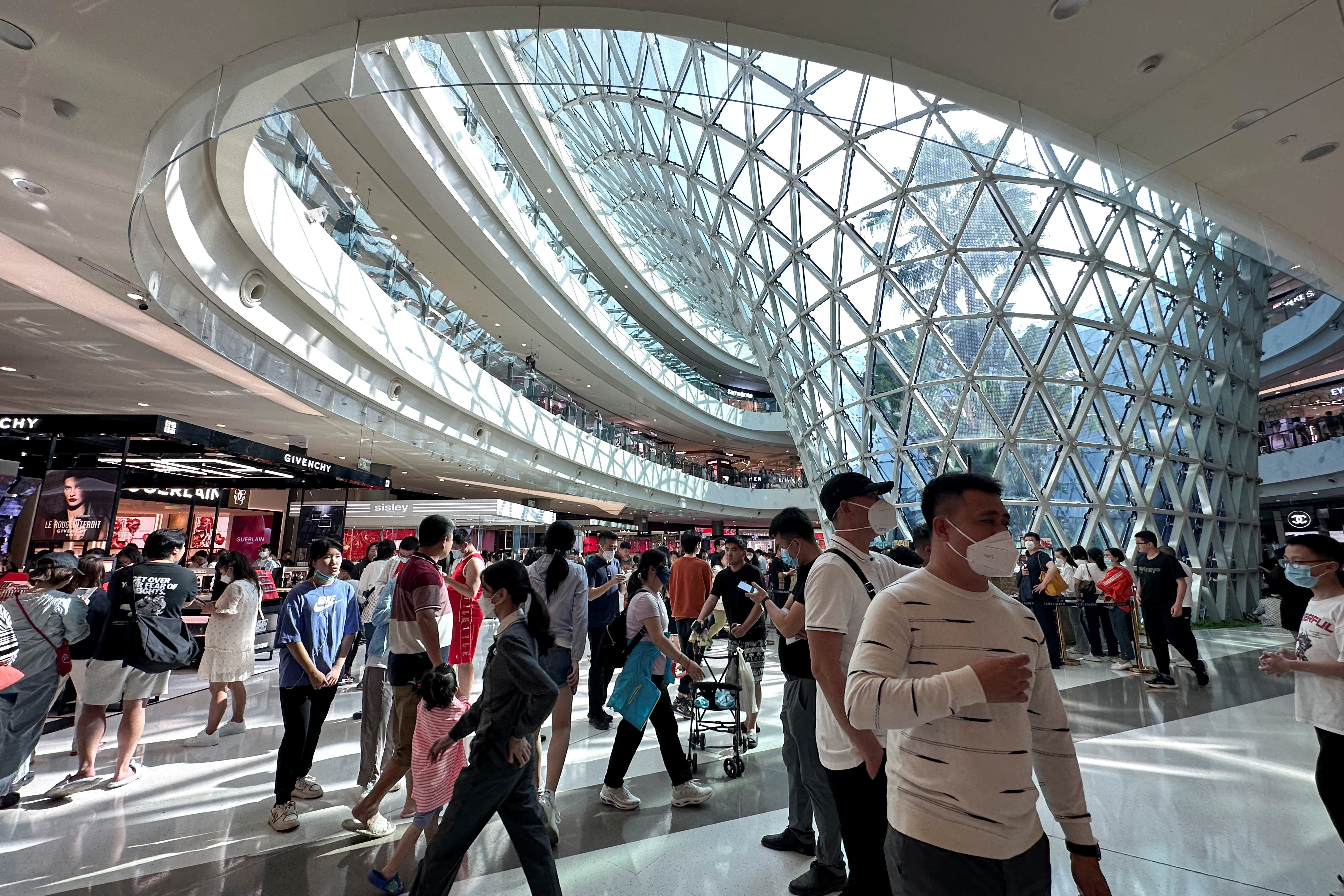 People walk in the Sanya International Duty-Free shopping complex in Sanya, Hainan province, China on January 25, 2023. Photo: Reuters