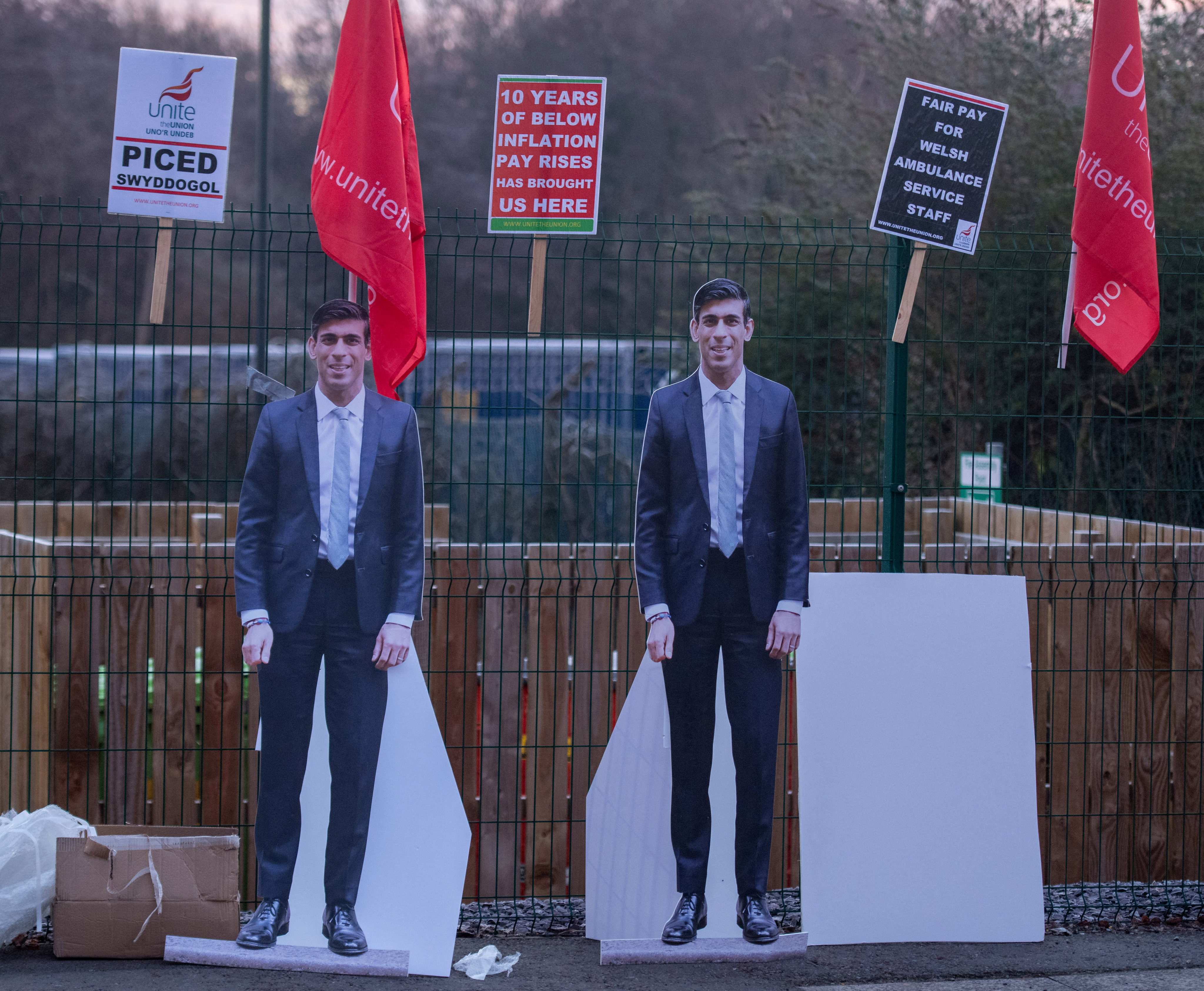 Placards depicting British Prime Minister Rishi Sunak are seen outside Cardiff Ambulance Station in Cardiff. Photo: Reuters