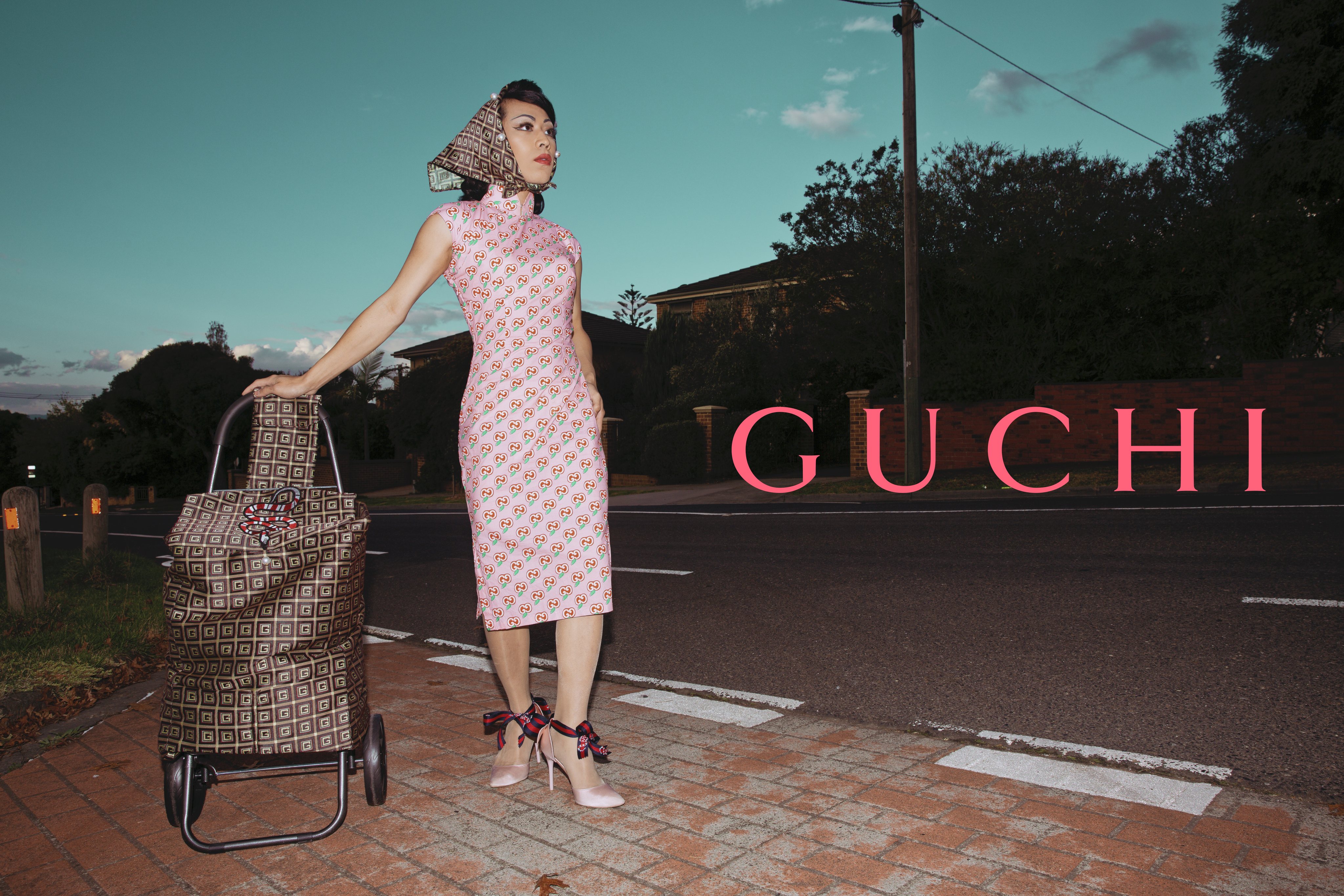 One of Scotty So’s mock luxury fashion campaigns featuring himself in a self-tailored cheongsam and a trolley bag covered in fake monograms that mimic those of leading fashion labels, part of his series “Hai KotTou, But Make It Fashion”. Photo: Courtesy of Scotty So