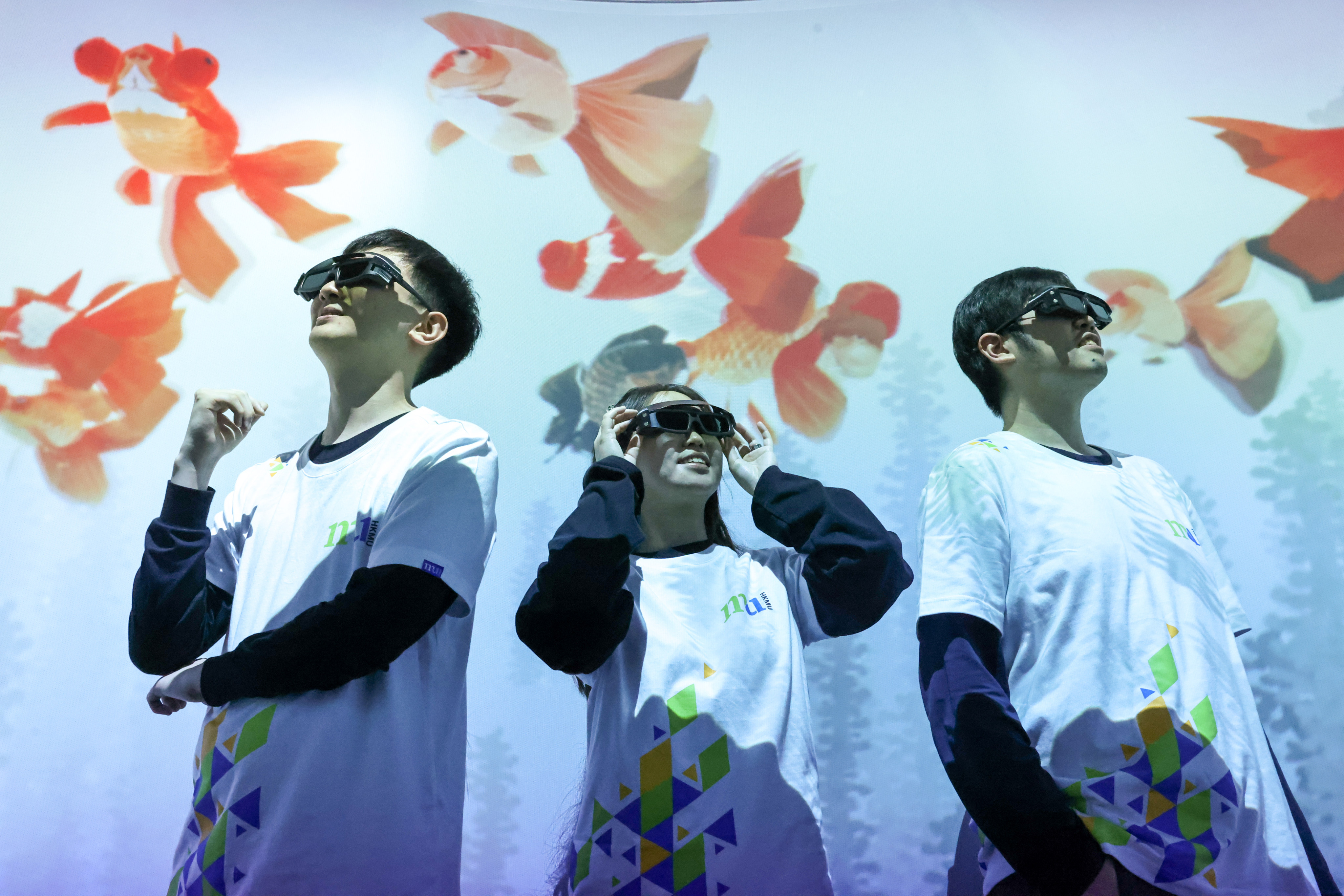 Creative arts undergraduates pose with their project, “Goldfish”, at an exhibition at the Hong Kong Metropolitan University’s Digital Art Laboratory on January 9. Photo: K.Y. Cheng