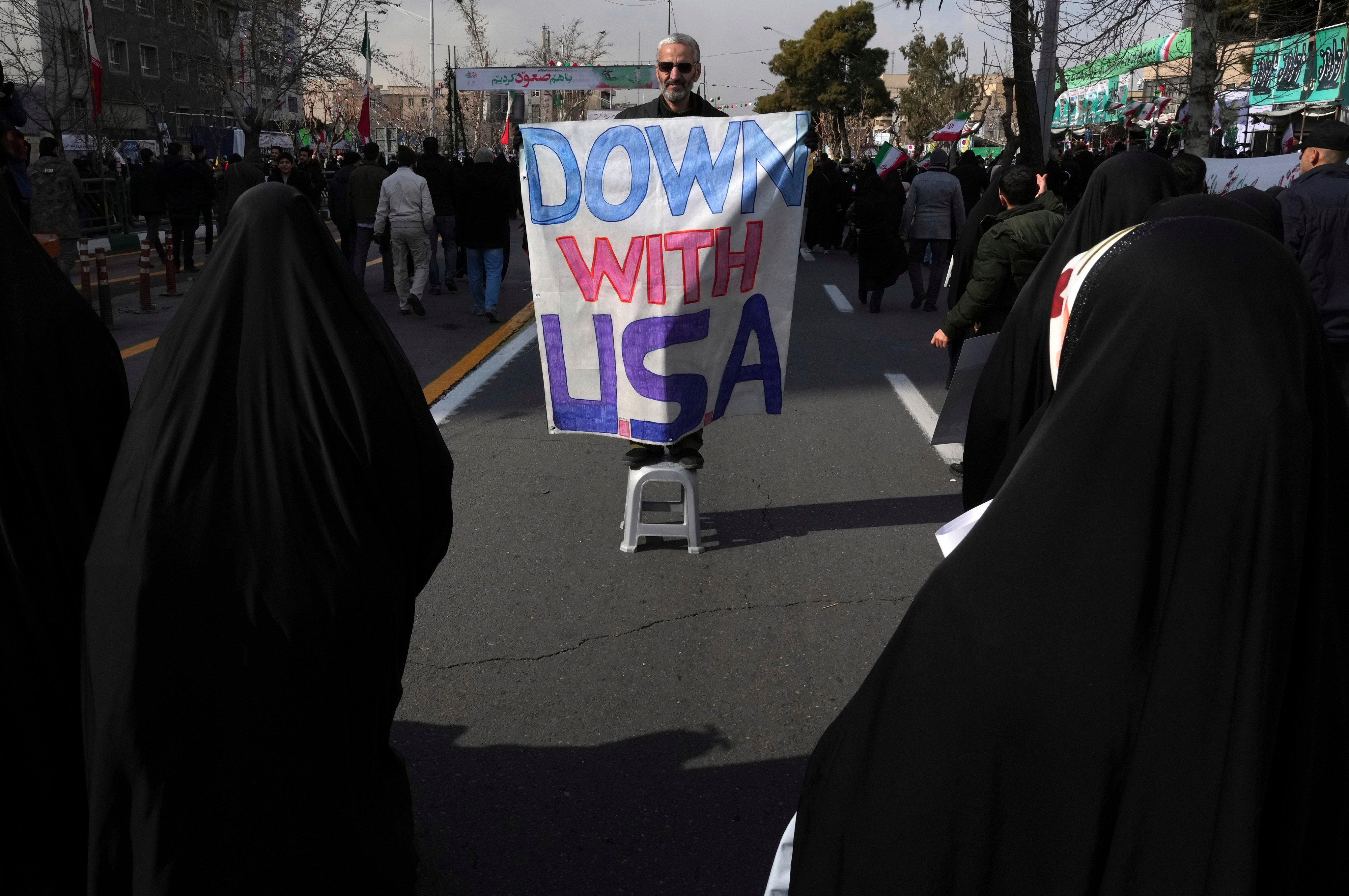 A man holds an anti-US sign during the annual rally commemorating Iran’s 1979 Islamic Revolution. Photo: AP