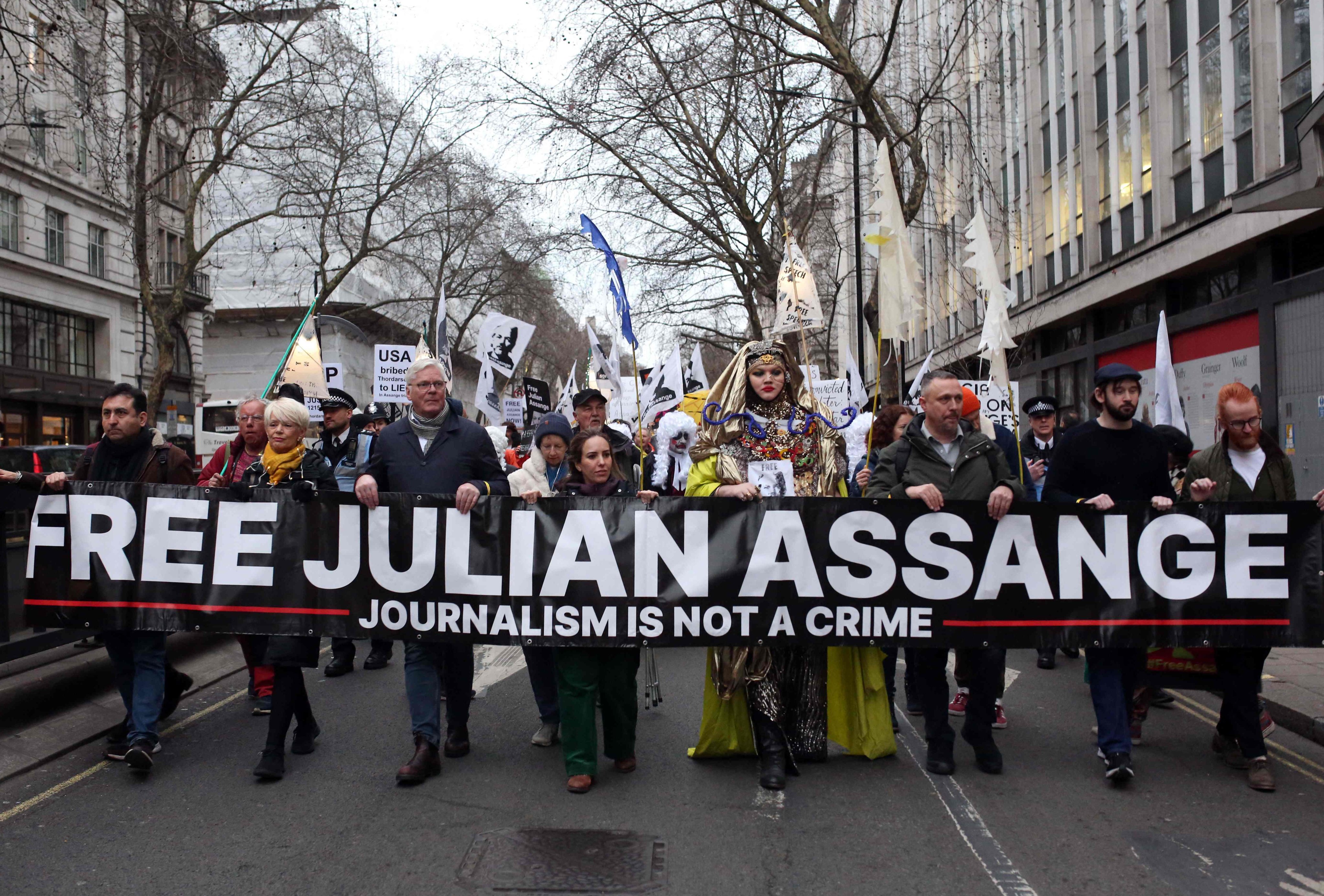 Supporters of WikiLeaks founder Julian Assange take part in a Night Carnival for Assange march in London on Saturday. Photo: AFP