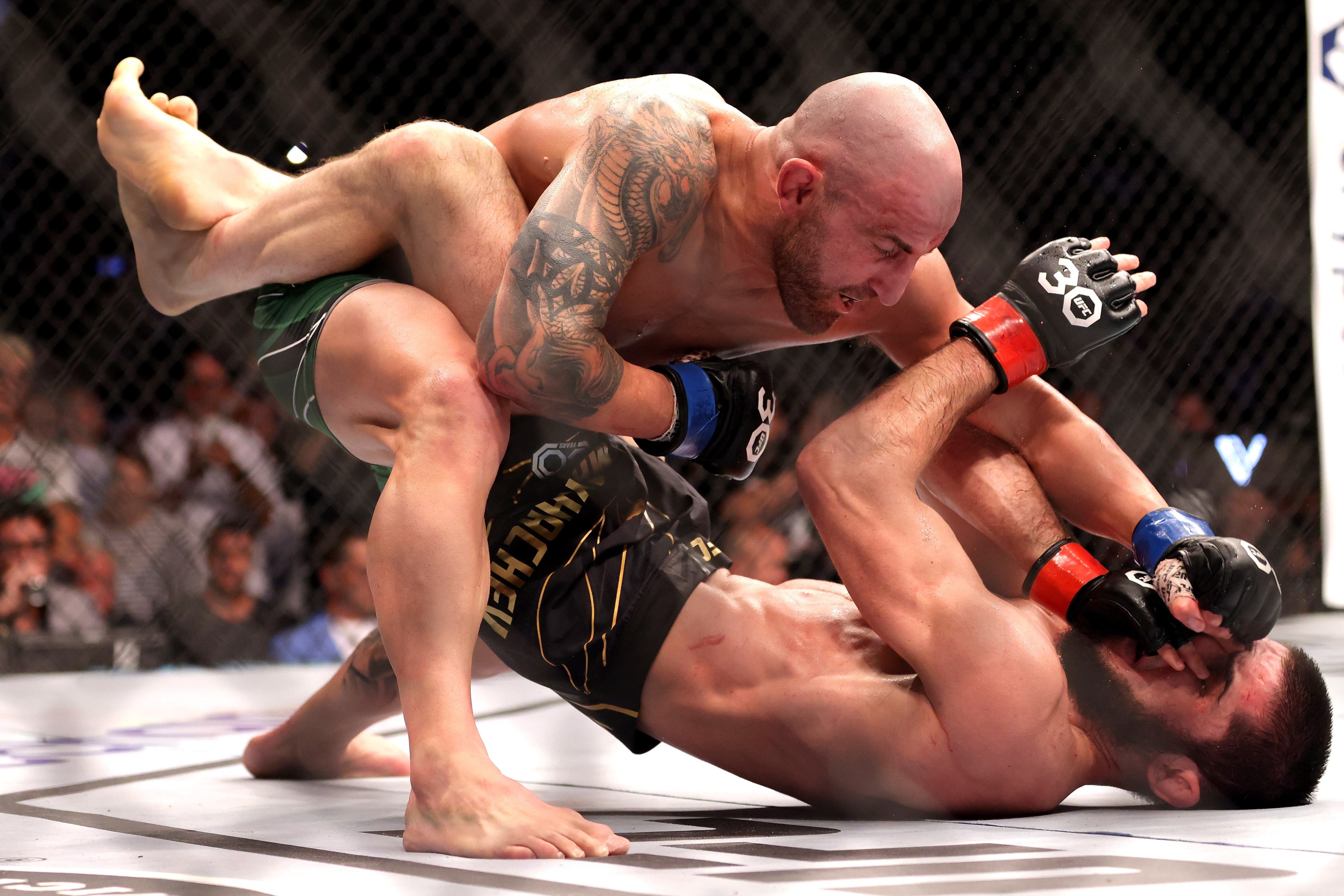 Alex Volkanovski delivers ground and pound to Islam Makhachev at UFC 284 at RAC Arena in Perth. Photo EPA-EFE