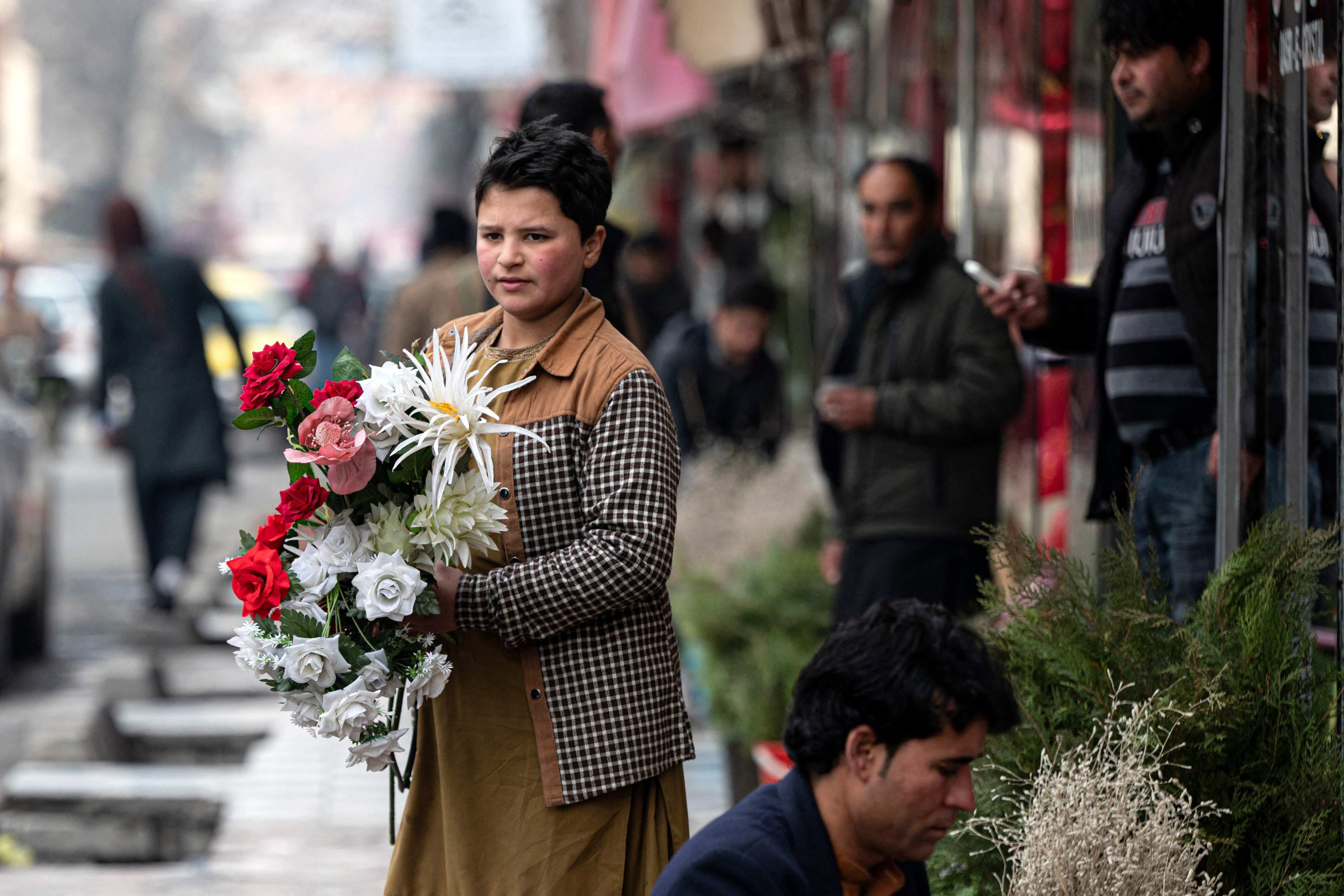 An Afghan vendor sells flowers in Kabul where Valentine’s Day is banned. Photo: AFP