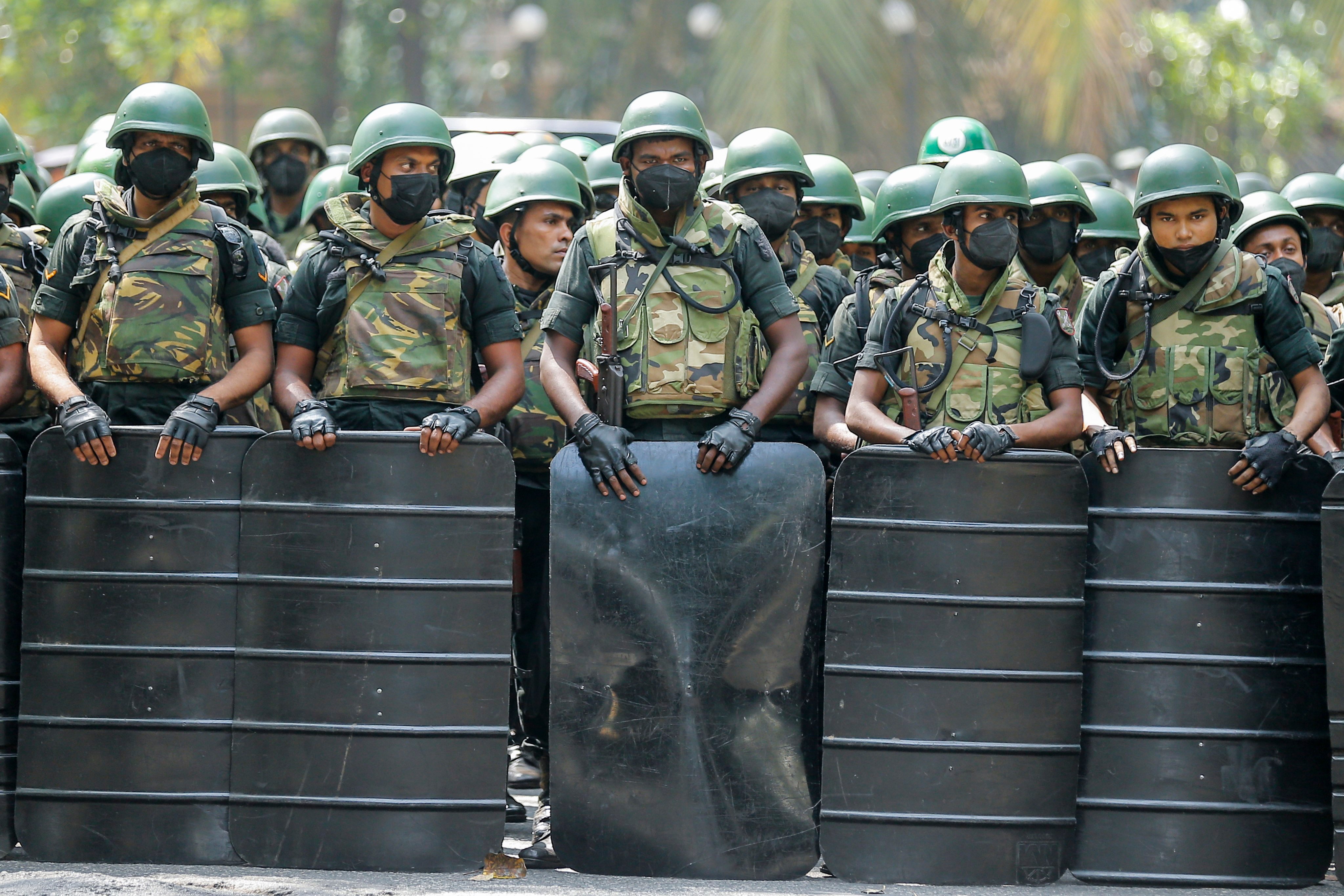 Soldiers block the road during a protest against new tax regulations in Colombo, Sri Lanka, on January 20. Protesters accuse the government of unfairly raising tax rates amid the worst economic crisis in decades. Photo: EPA-EFE