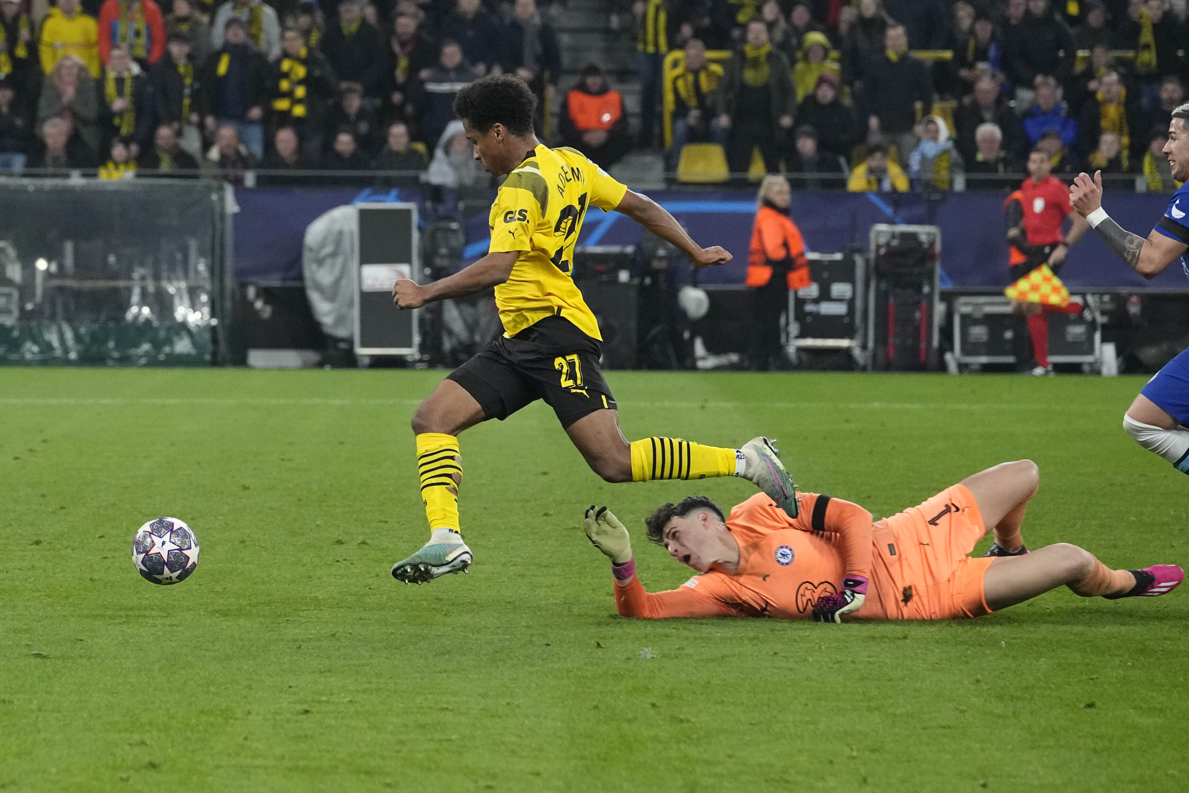 Karim Adeyemi rounds Chelsea’s goalkeeper Kepa Arrizabalaga to score for Borussia Dortmund in the Champions League. Photo: AP