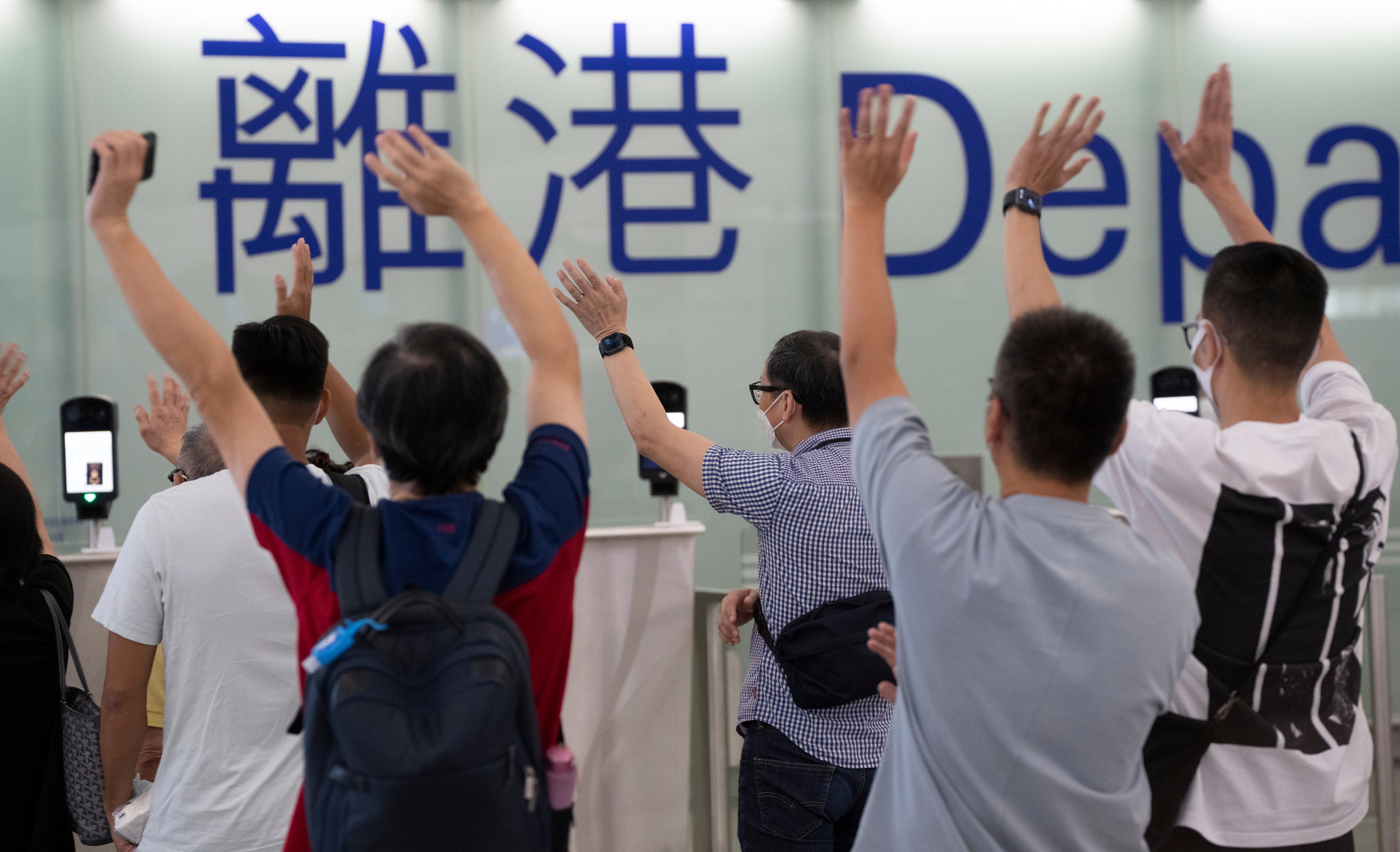 Friends and family wave goodbye to travellers at the Hong Kong International Airport. Photo: Robert Ng