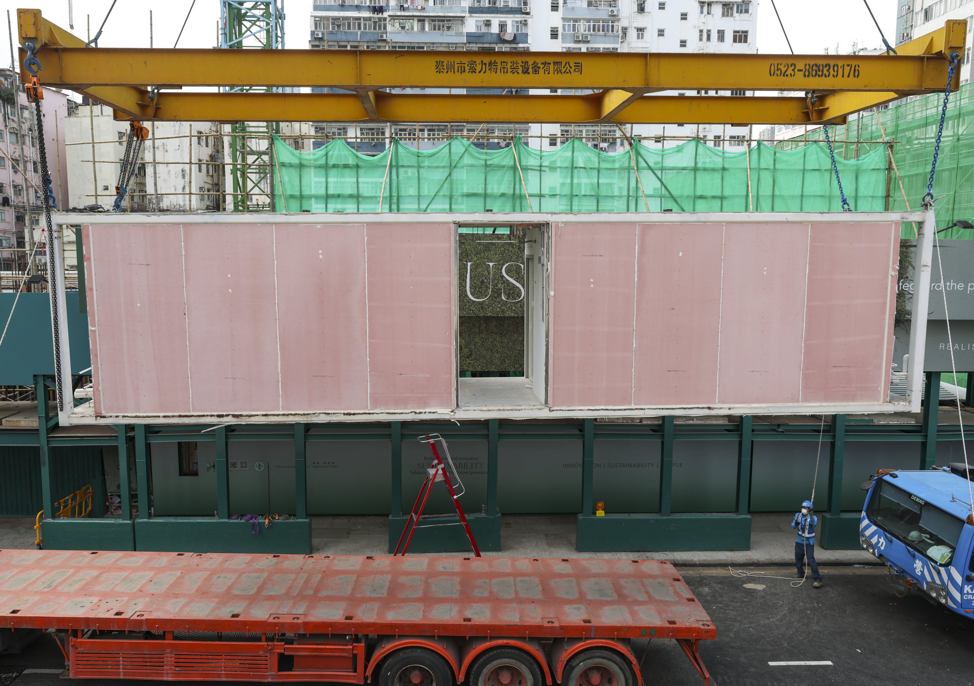 Workers dismantle Hong Kong’s pioneering transitional housing project ...