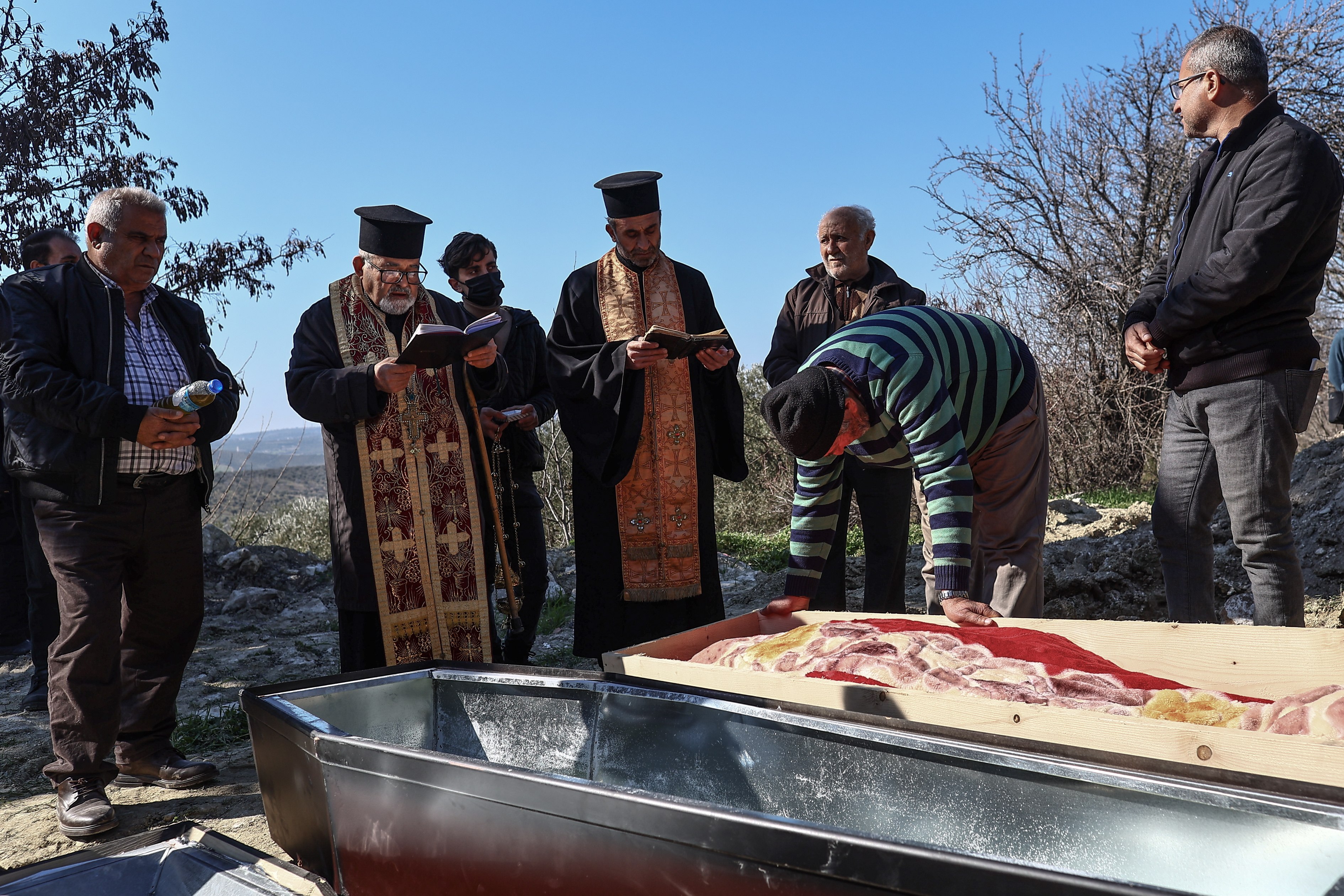 Mourners attend the funeral of a relative who died after the powerful earthquake on February 6, at Tokacli village near Hatay, Turkey on Friday. Photo: EPA-EFE