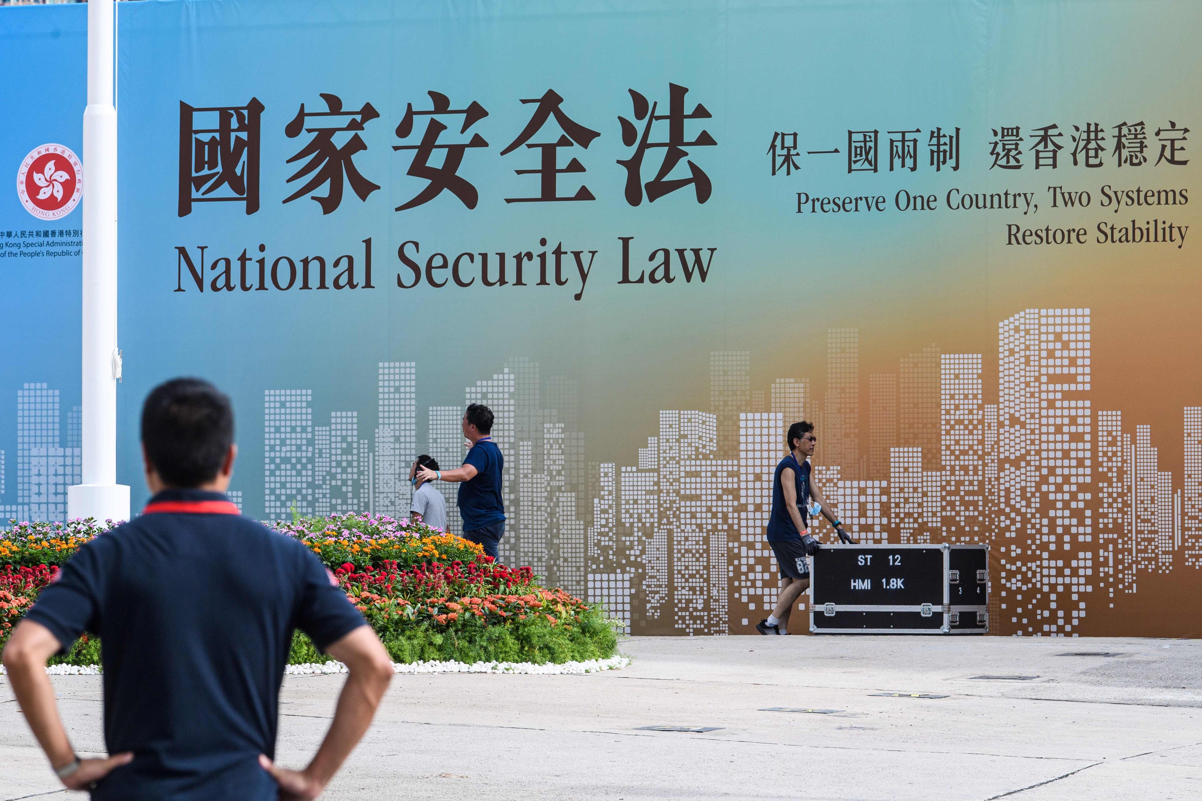 A national security law banner in Hong Kong on July 1, 2020. Beijing adopted a minimalist approach, only legislating for those laws immediately required to cope with 2019 social disorder. Photo: AFP