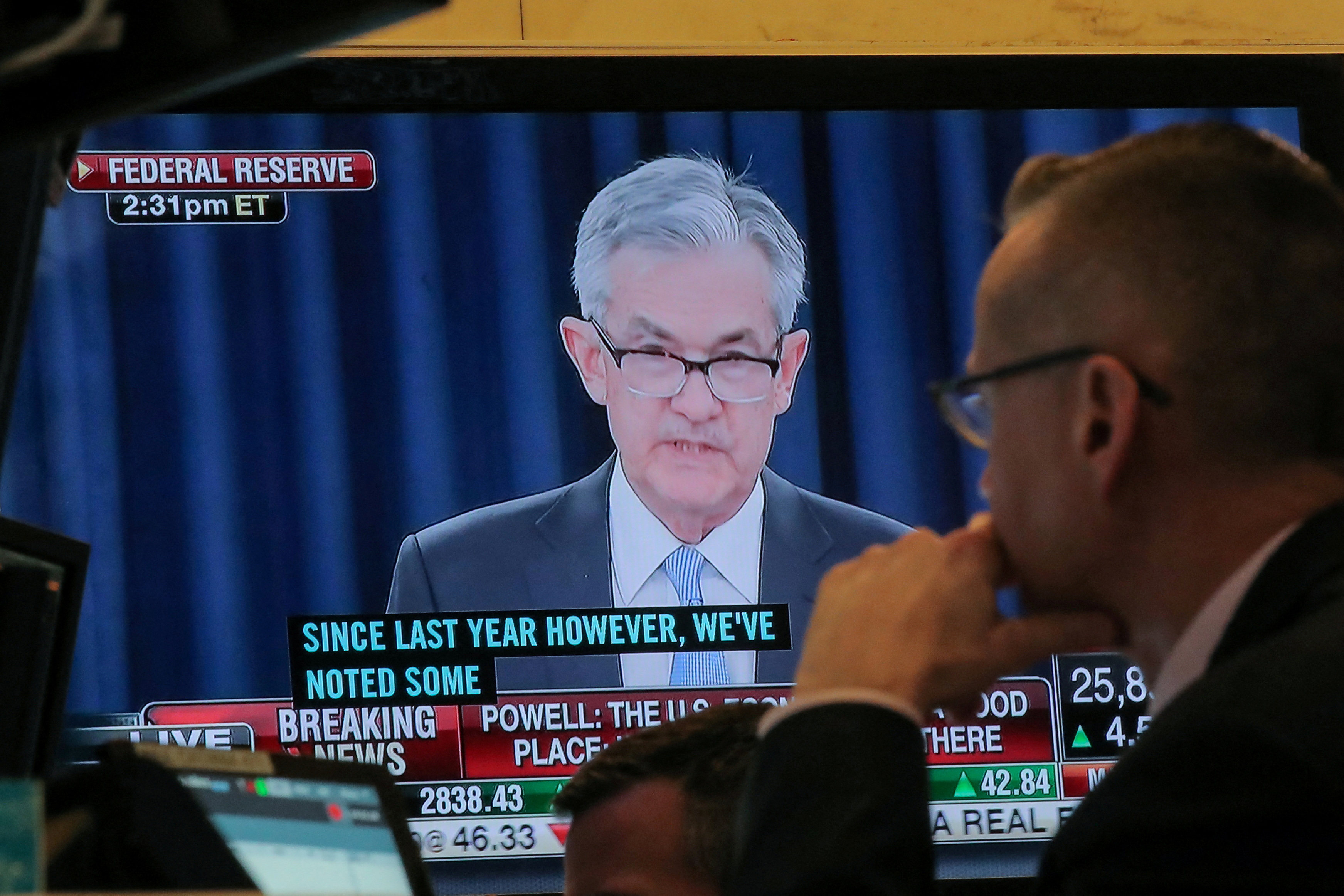 A trader watches US Federal Reserve chairman Jerome Powell on a screen at the New York Stock Exchange. International investors are following the Fed’s lead and selling off US government debt, suggesting ebbing investor confidence as the US Congress is at an impasse over the debt ceiling. Photo: Reuters