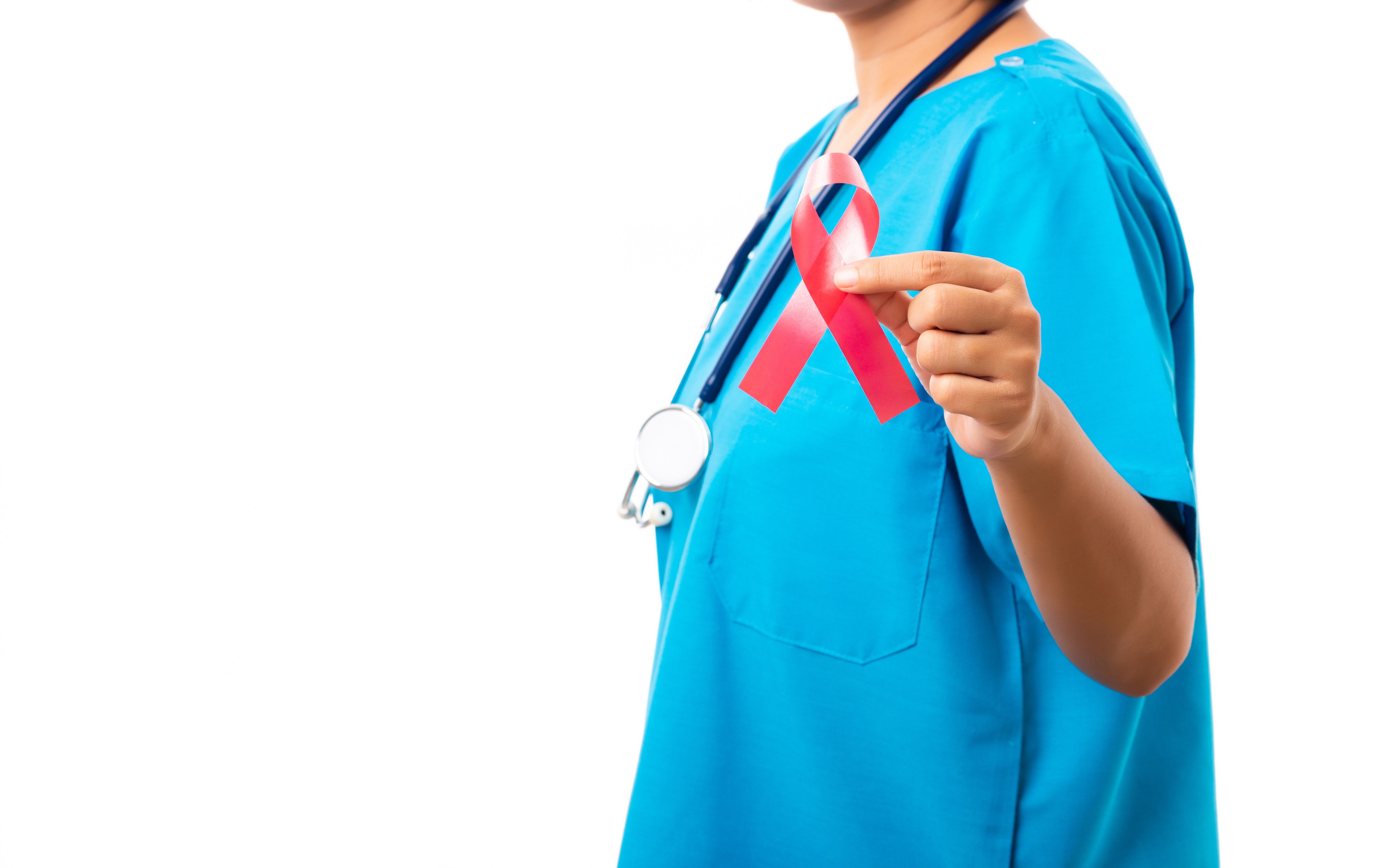 A nurse holds a ribbon in support of HIV and Aids awareness. Photo: Shutterstock