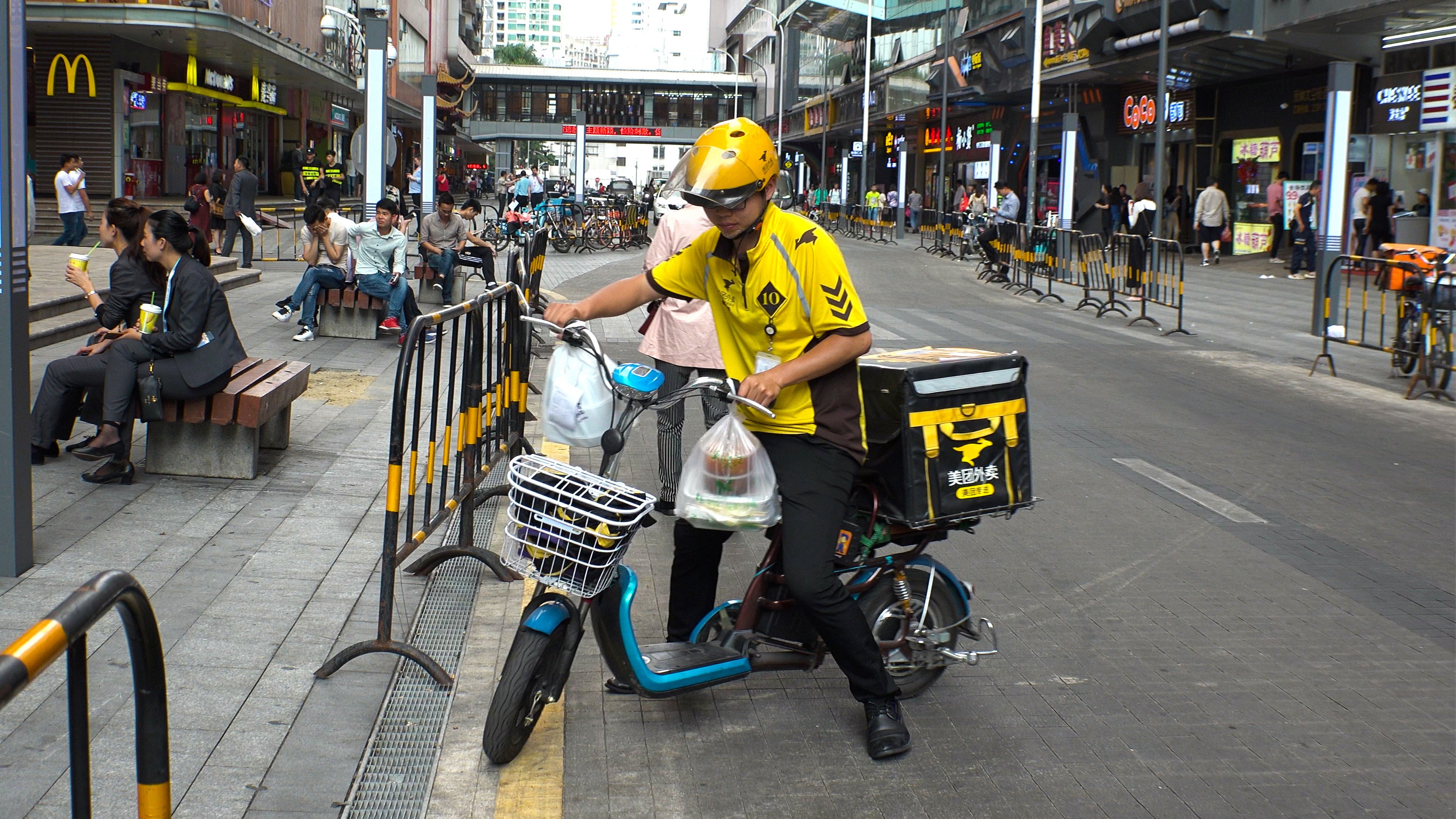 A Meituan food delivery rider is seen at a street in Shenzhen, in southern Guangdong province, in April 2018. Photo: Shutterstock