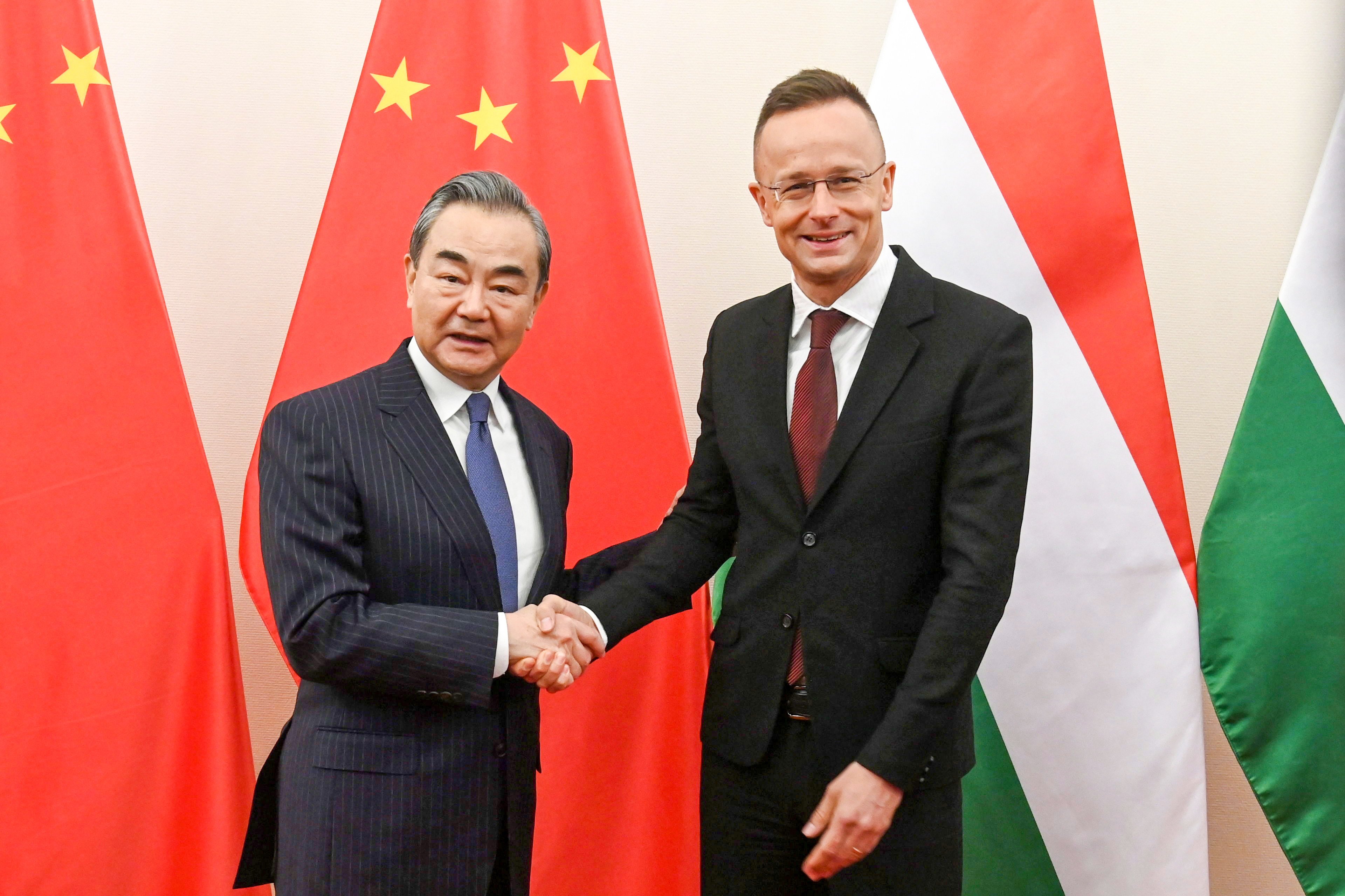 Hungary’s Minister of Foreign Affairs and Trade Peter Szijjarto (right) welcomes China’s Foreign Minister Wang Yi in Budapest. Photo: EPA-EFE