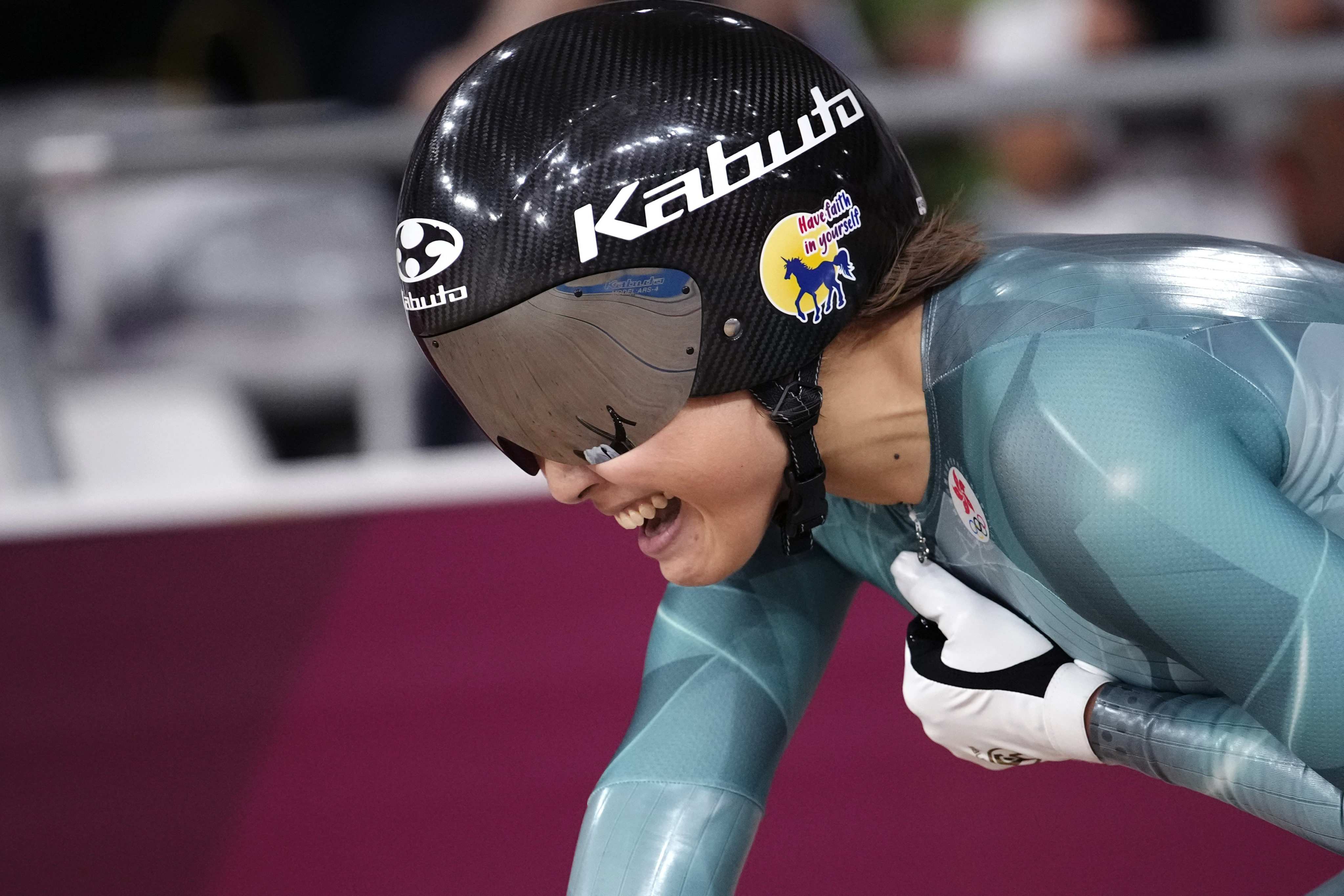 Wai Sze Lee of Team Hong Kong reacts to winning the bronze medal during the track cycling women’s sprint race at the 2020 Summer Olympics, Sunday, Aug. 8, 2021, in Izu, Japan. (AP Photo/Christophe Ena)