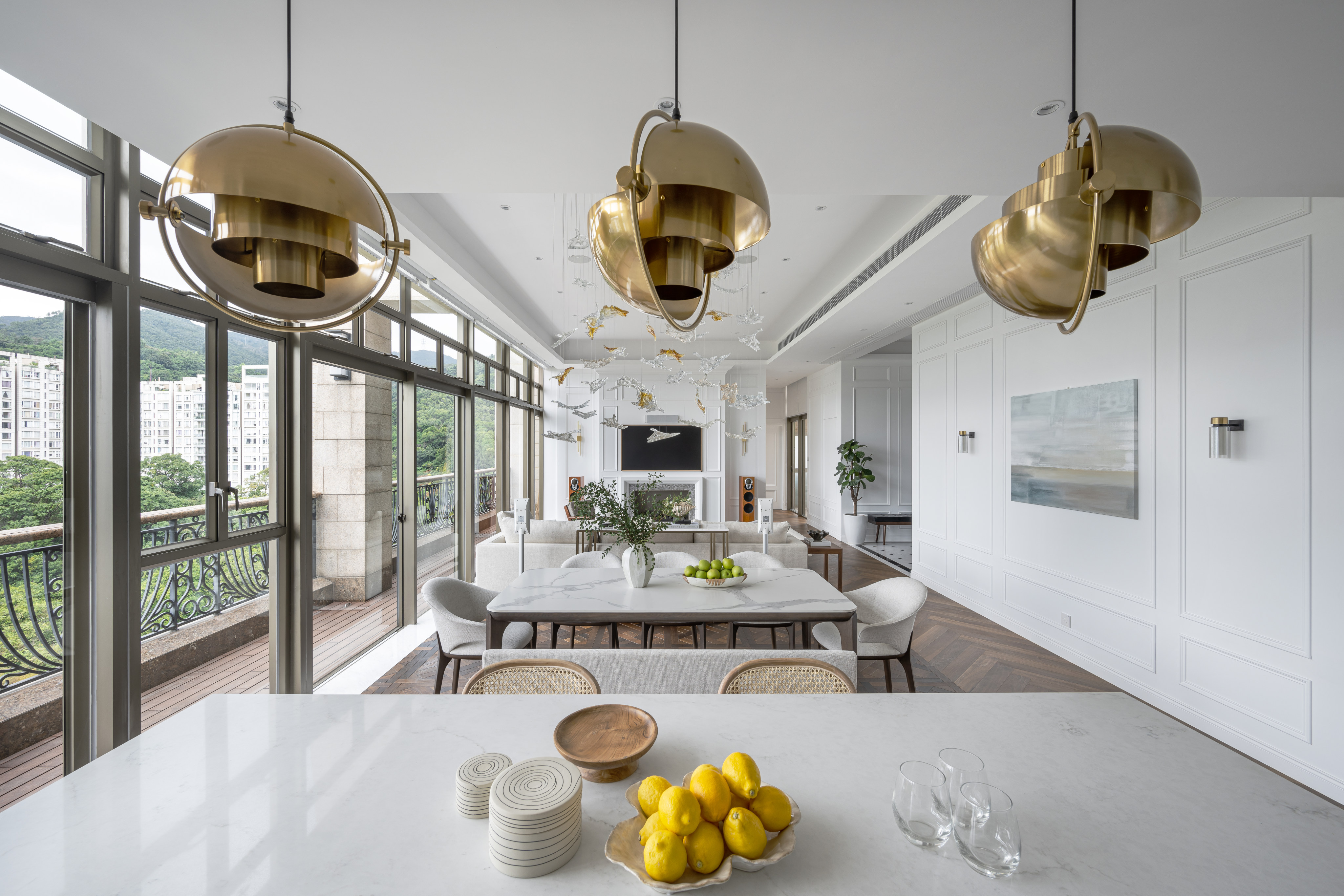 The 850 sq ft living area, divided into two zones, at the Sha Tin home of Alex Lanoie and Kerry Li. The Grande Interior Design studio renovated the 2,293 sq ft penthouse apartment with private rooftop swimming pool, adding a study, nursery and dressing room. Photo: Dick Liu