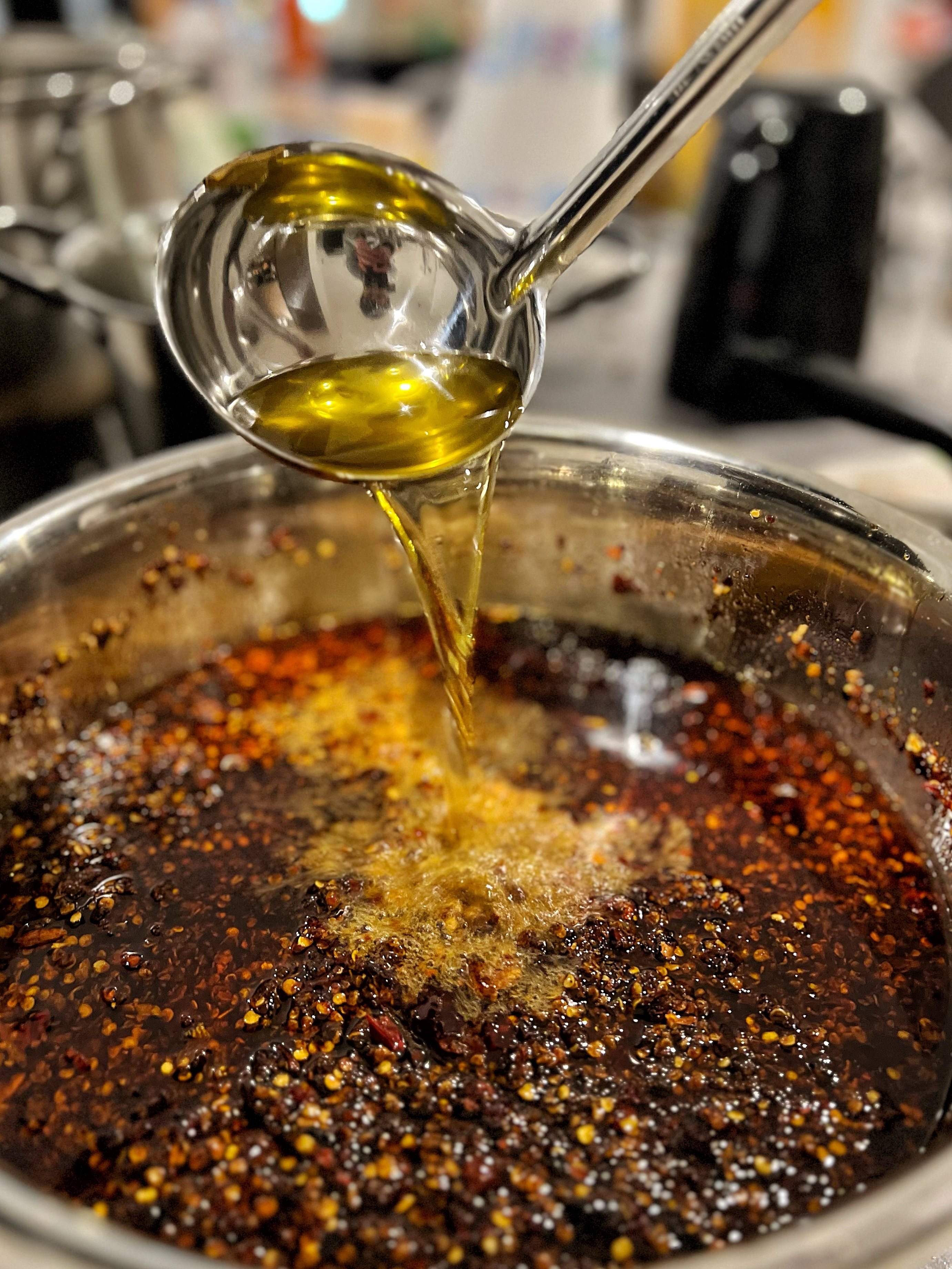 Isaac Lau making Shall We Dine’s spicy sauce. Photo: Isaac Lau