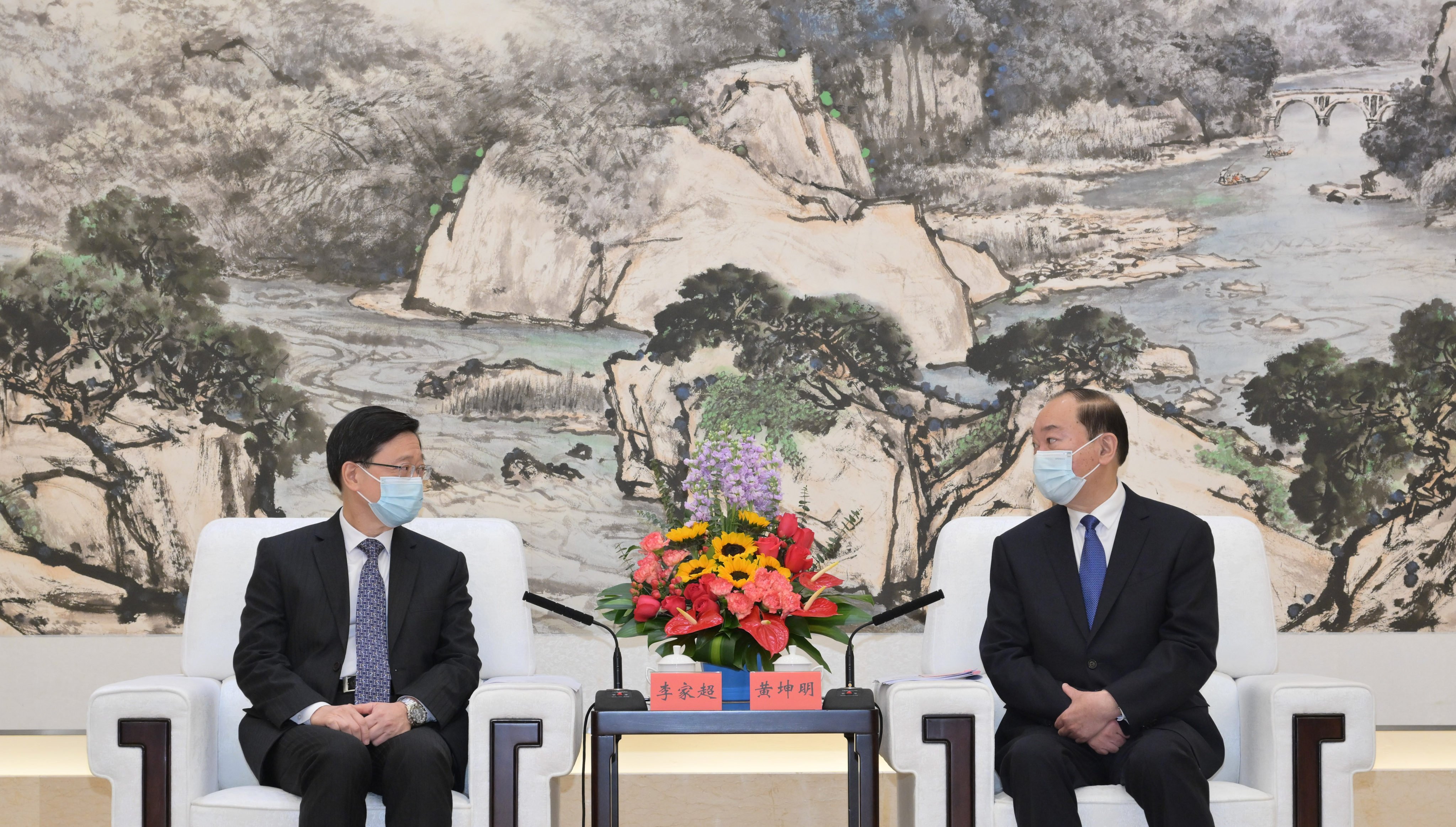 John Lee (left) and Guangdong party secretary Huang Kunming  in Guangzhou. Photo: Handout