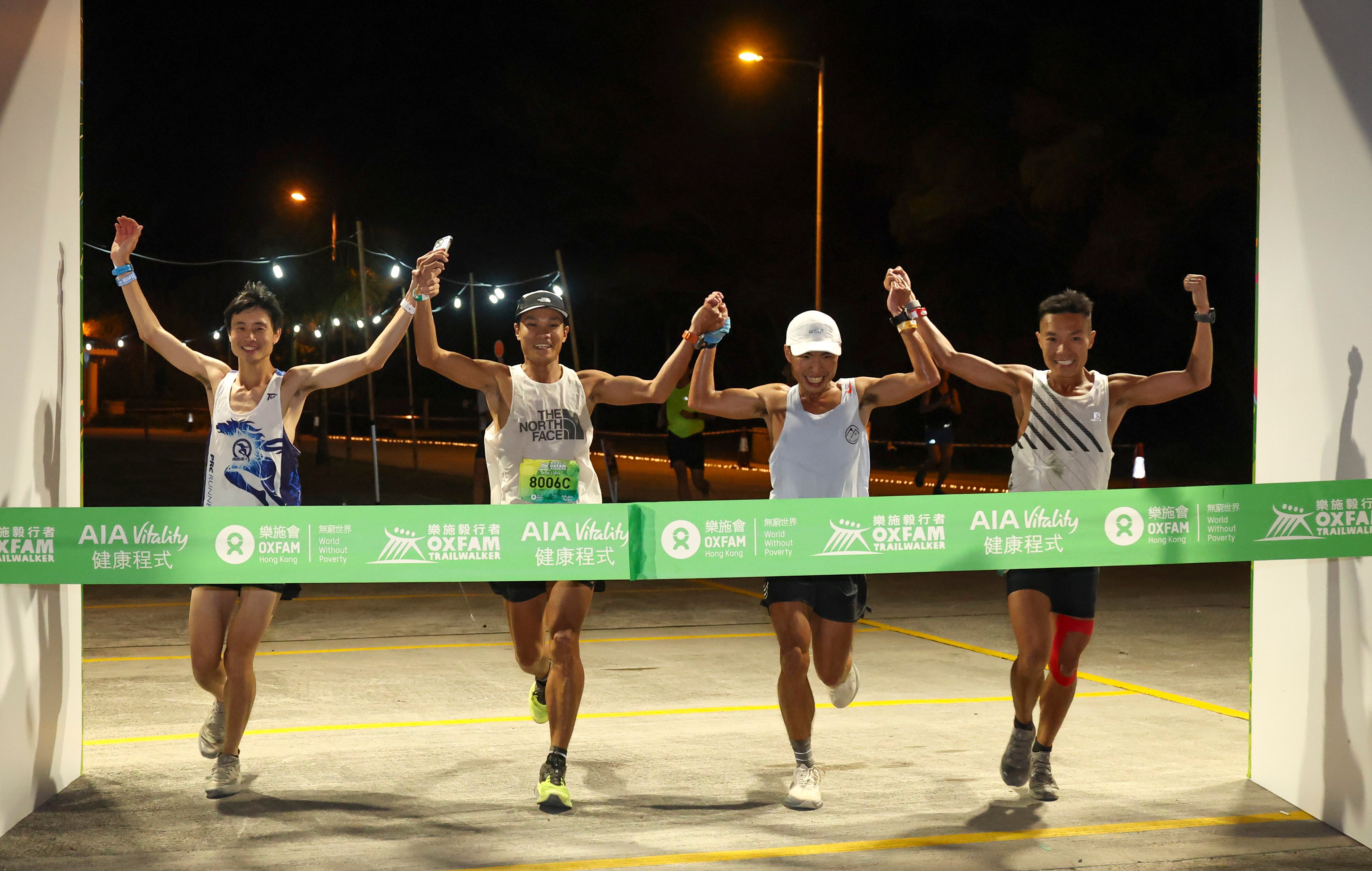 From left to right, Woody Wu Man-tsung, Wong Ho-chung; Tsang Fuk-cheung and Joseph Yeung of Team 8006, first finish the 2023 Oxfam Trailwalker in 11 hours and 38 minutes at Yuen Long. Photo: Edmond So