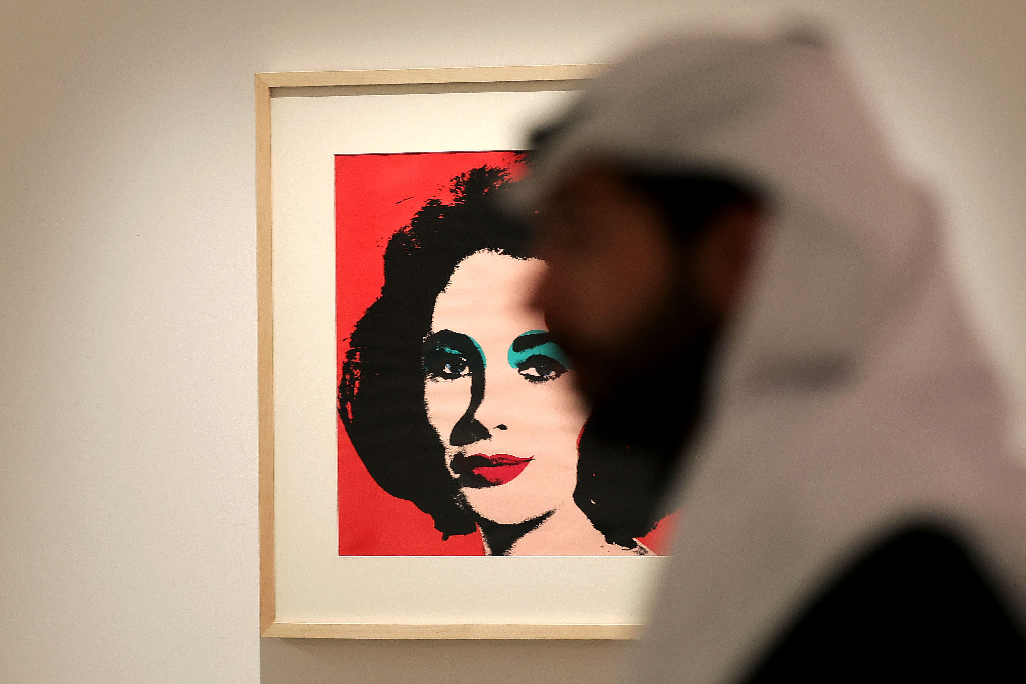 A man visits an exhibition of works by the late US artist Andy Warhol at the Maraya concert hall in Al-‘Ula, Saudi Arabia, on February 19, 2023. Photo: AFP