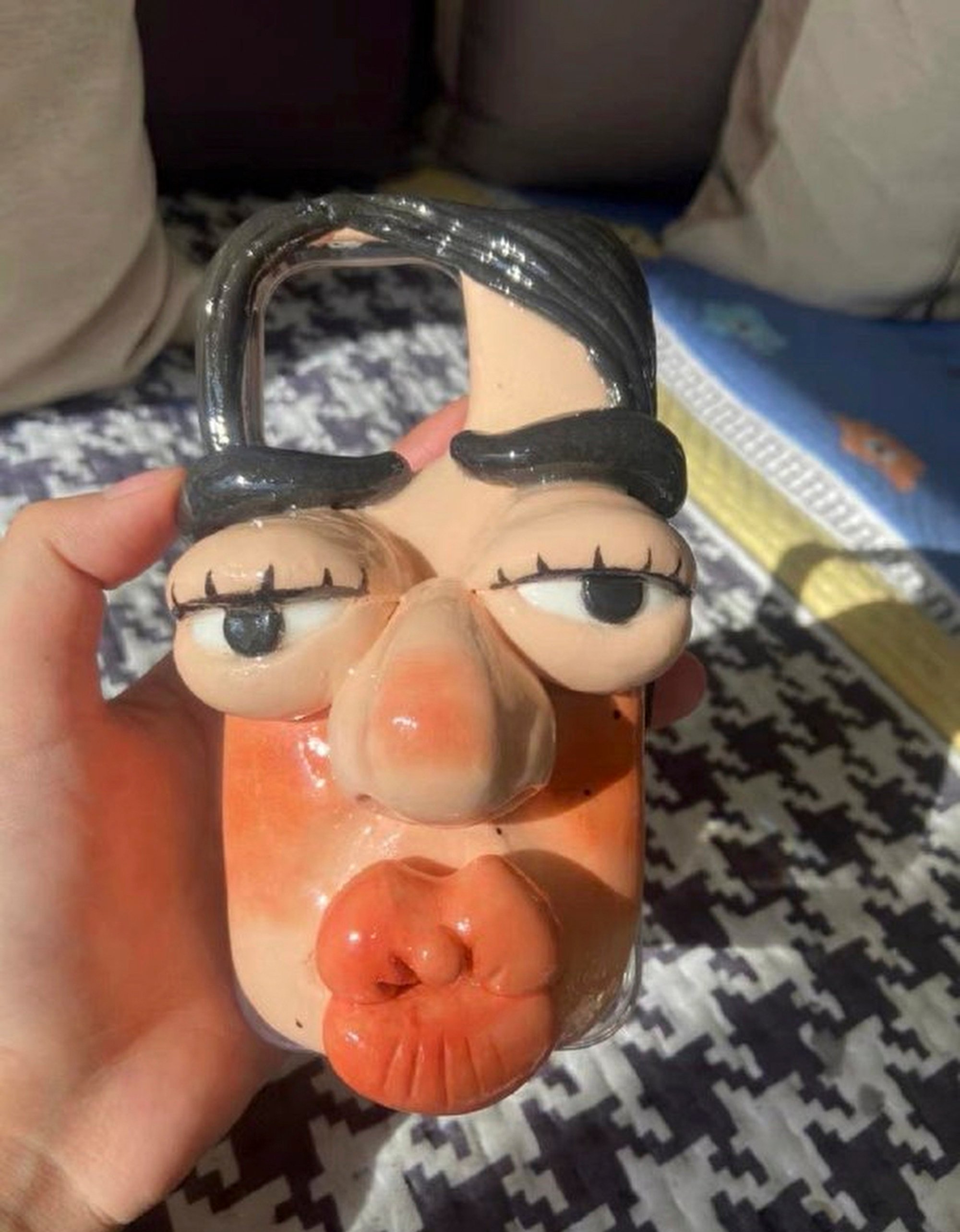 The maker of the clay human face phone cases says each one takes hours to make. Photo: Weibo