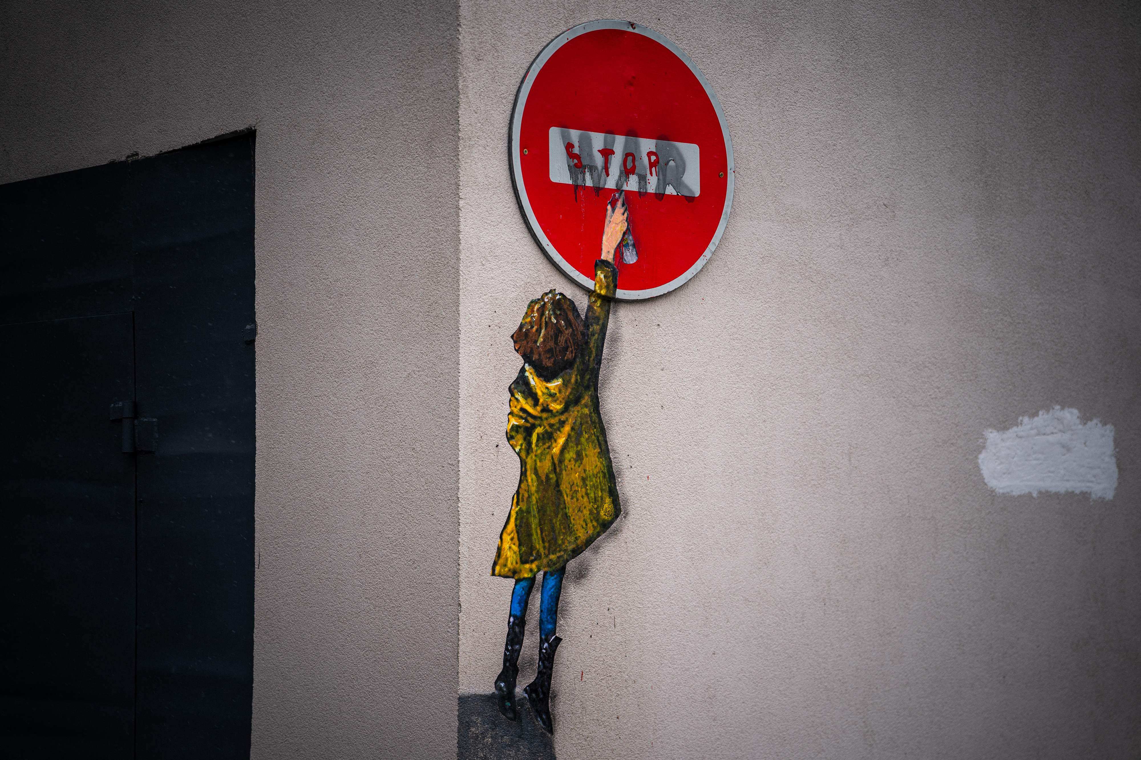 A mural by Italian urban artist Tvboy is seen on a wall in Bucha, Ukraine, on February 1. Photo: AFP