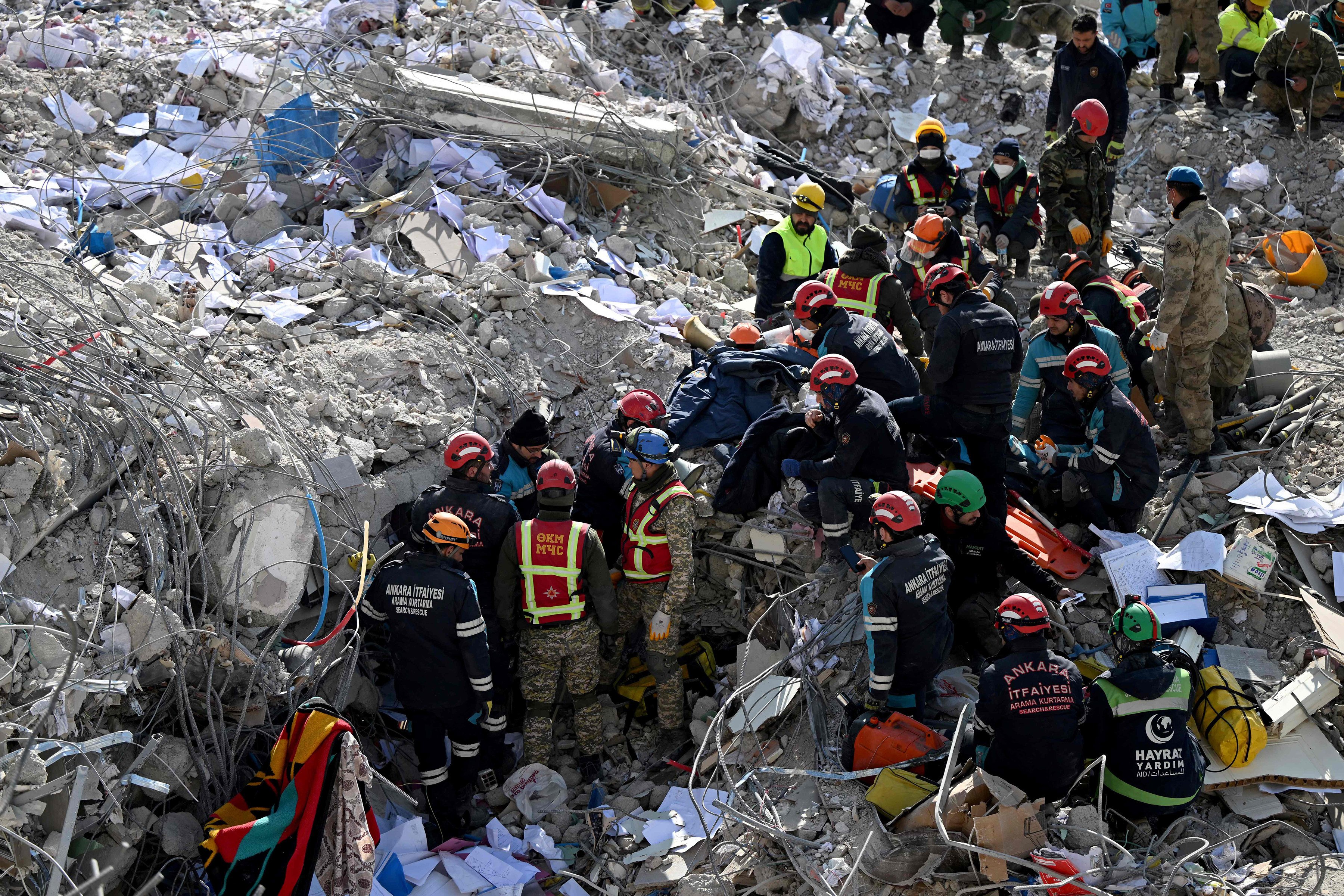 Ankara fire department and Kirgiz search and rescue teams search the rubble of collapsed buildings in Kahramanmaras on February 14, 2023, in the aftermath of the February 6 earthquake that killed over 40,000 people. Photo: AFP via Getty Images
