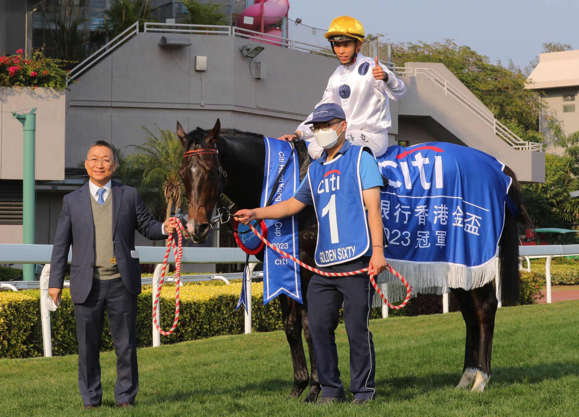 Trainer Francis Lui and jockey Vincent Ho enjoy Golden Sixty’s Gold Cup win.