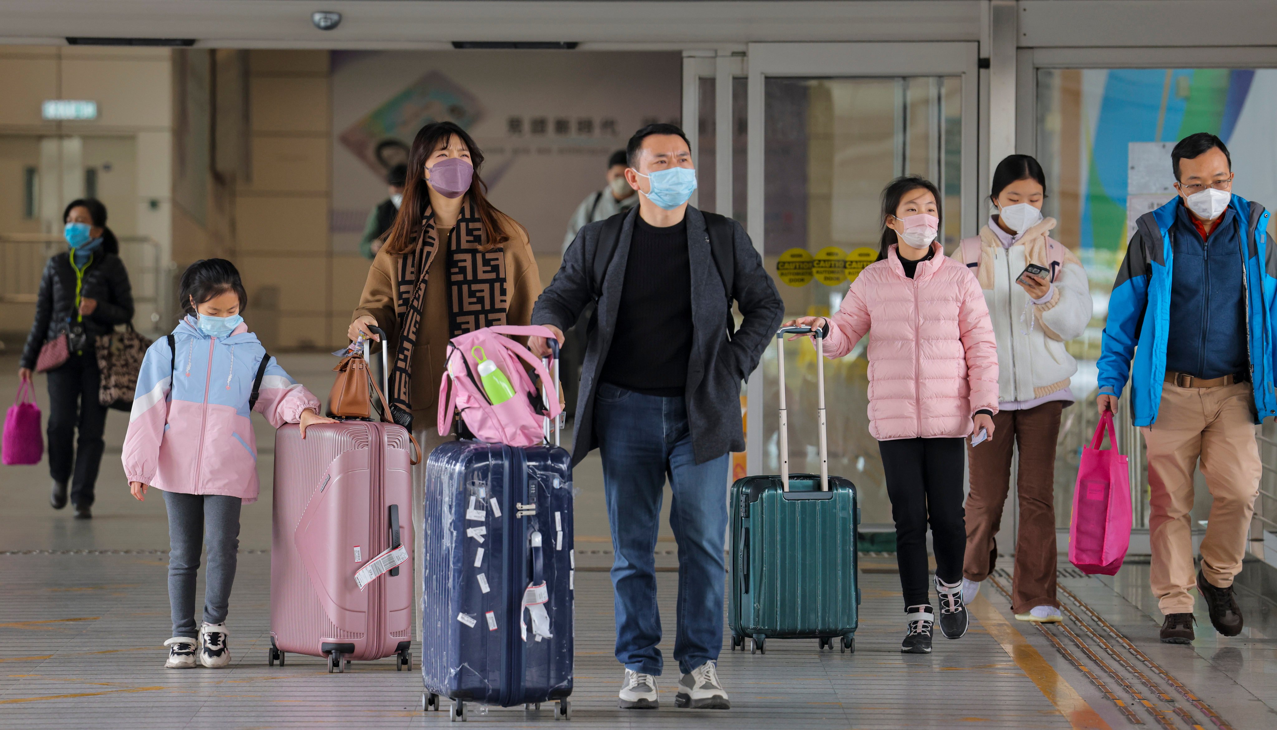 Travellers arrive in Hong Kong from mainland China. Photo: Jelly Tse