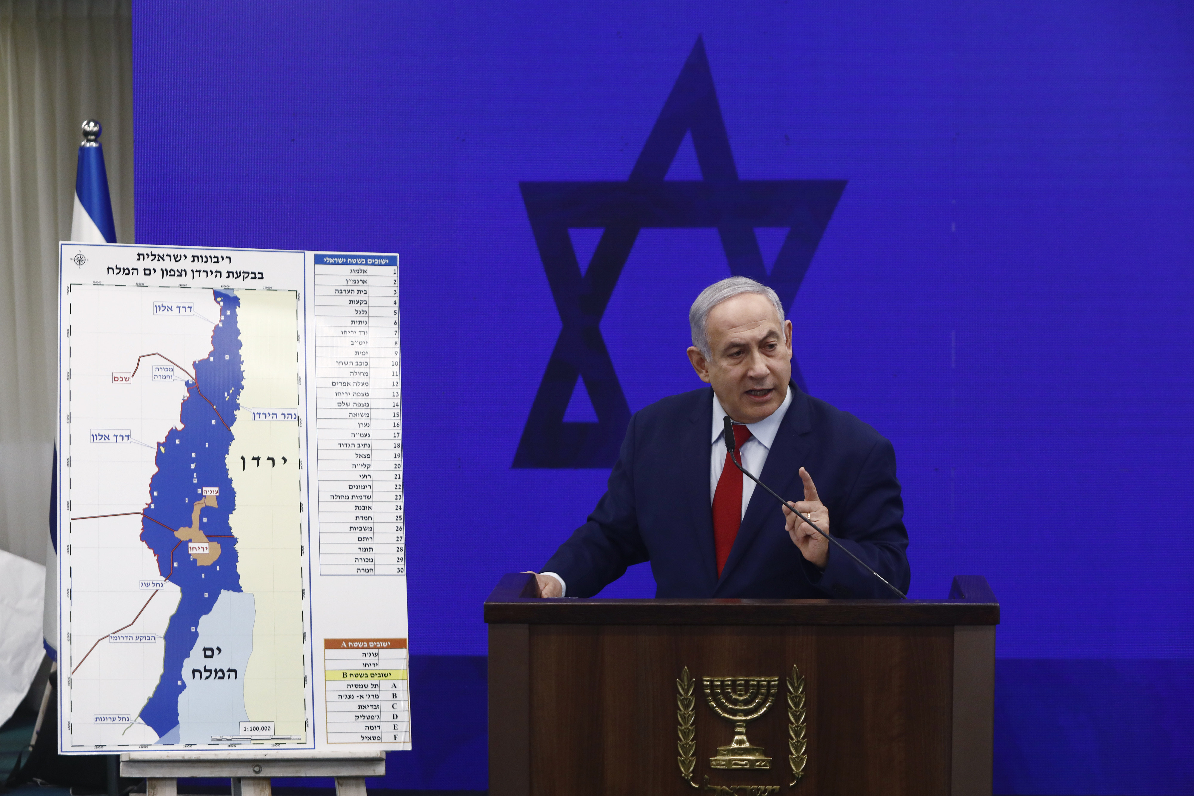 Israeli Prime Minister Benjamin Netanyahu next to a map of the Jordan Valley during an event in Tel Aviv, Israel in 2019. Photo: Photographer: Bloomberg