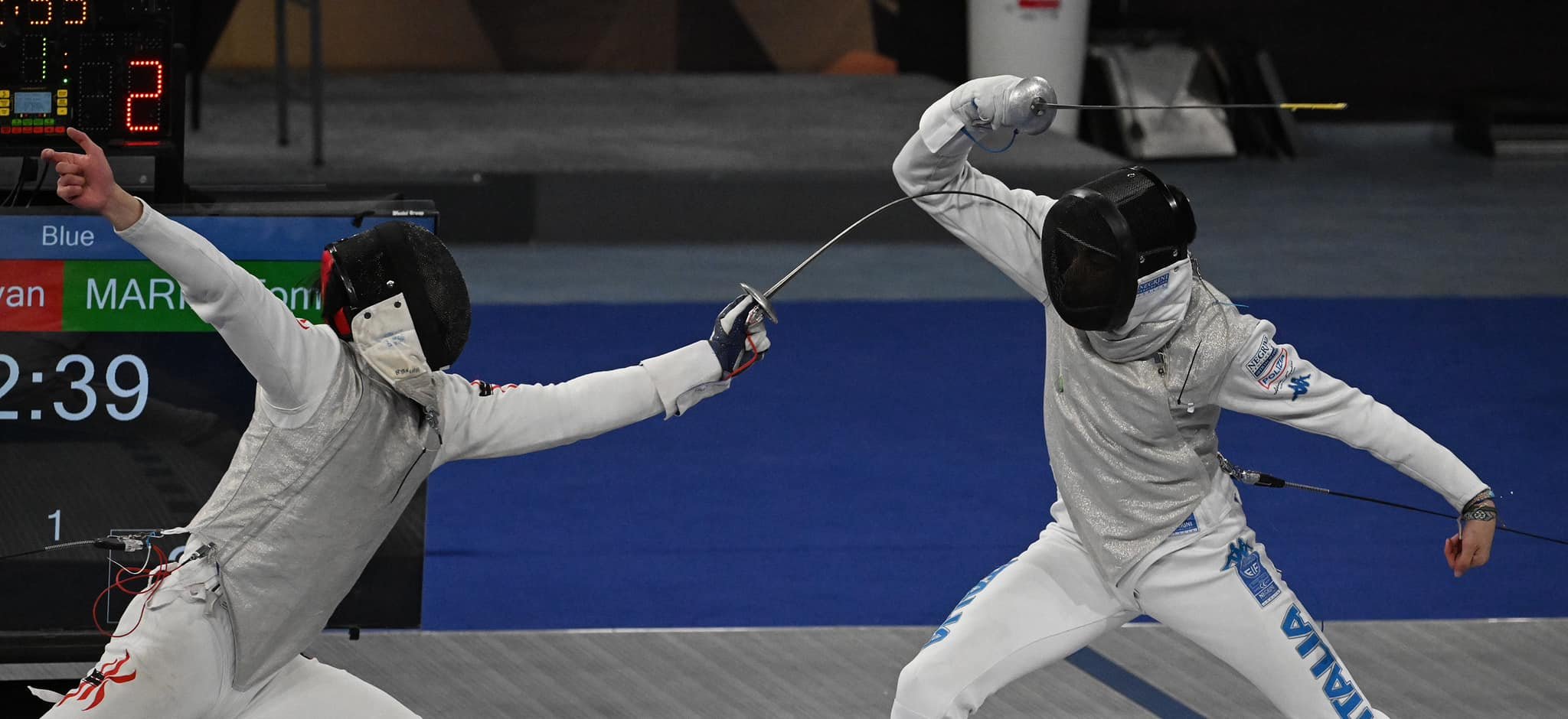Ryan Choi (left) against world number one Tommaso Marini of Italy in the team competition of the World Cup series in Cairo. Photo: FIE
