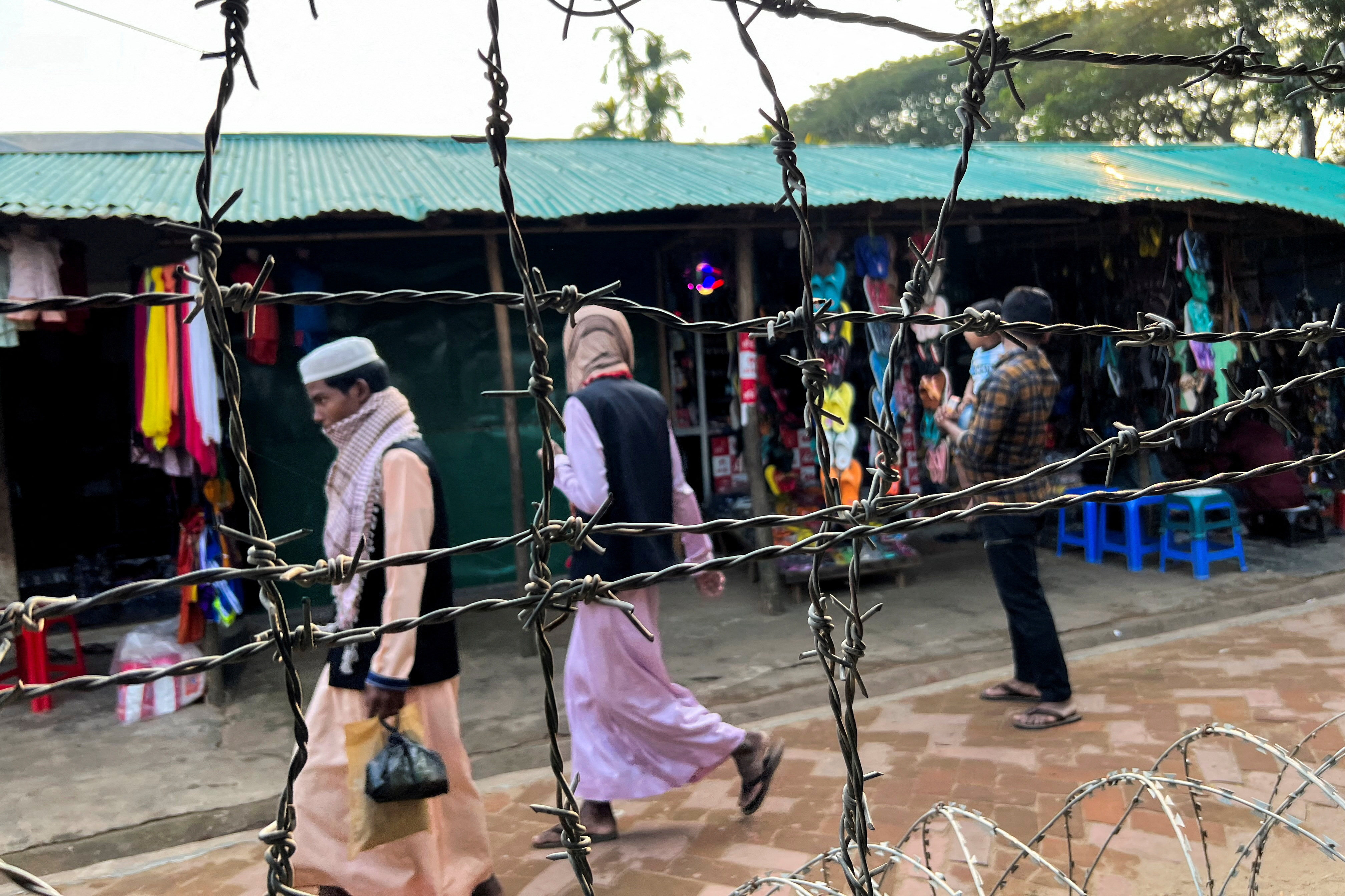Barbed wire is seen on the side of a refugee camp in Cox’s Bazar, Bangladesh. Photo: Reuters
