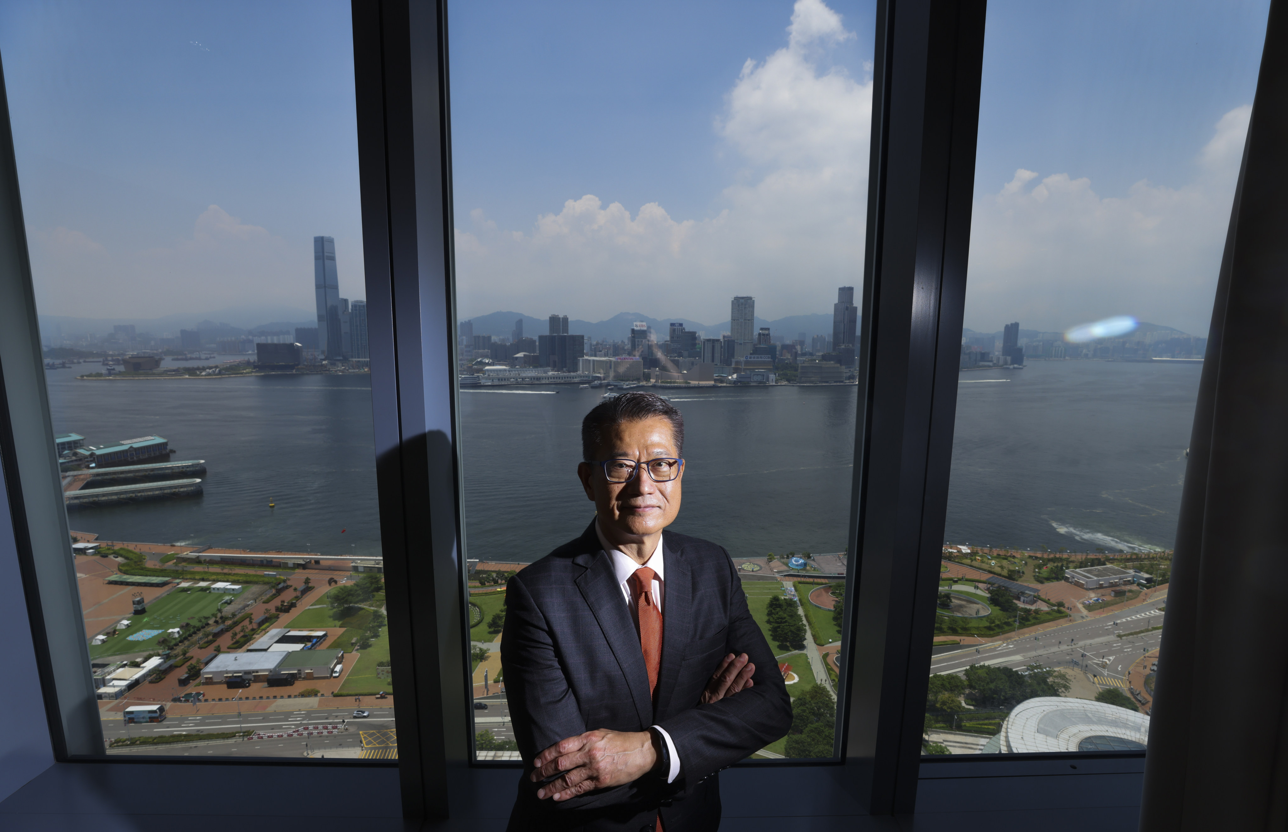 Financial Secretary Paul Chan at government’s headquarters in Admiralty, with the Kowloon skyline in the background, on July 25, 2022. Photo: Nora Tam