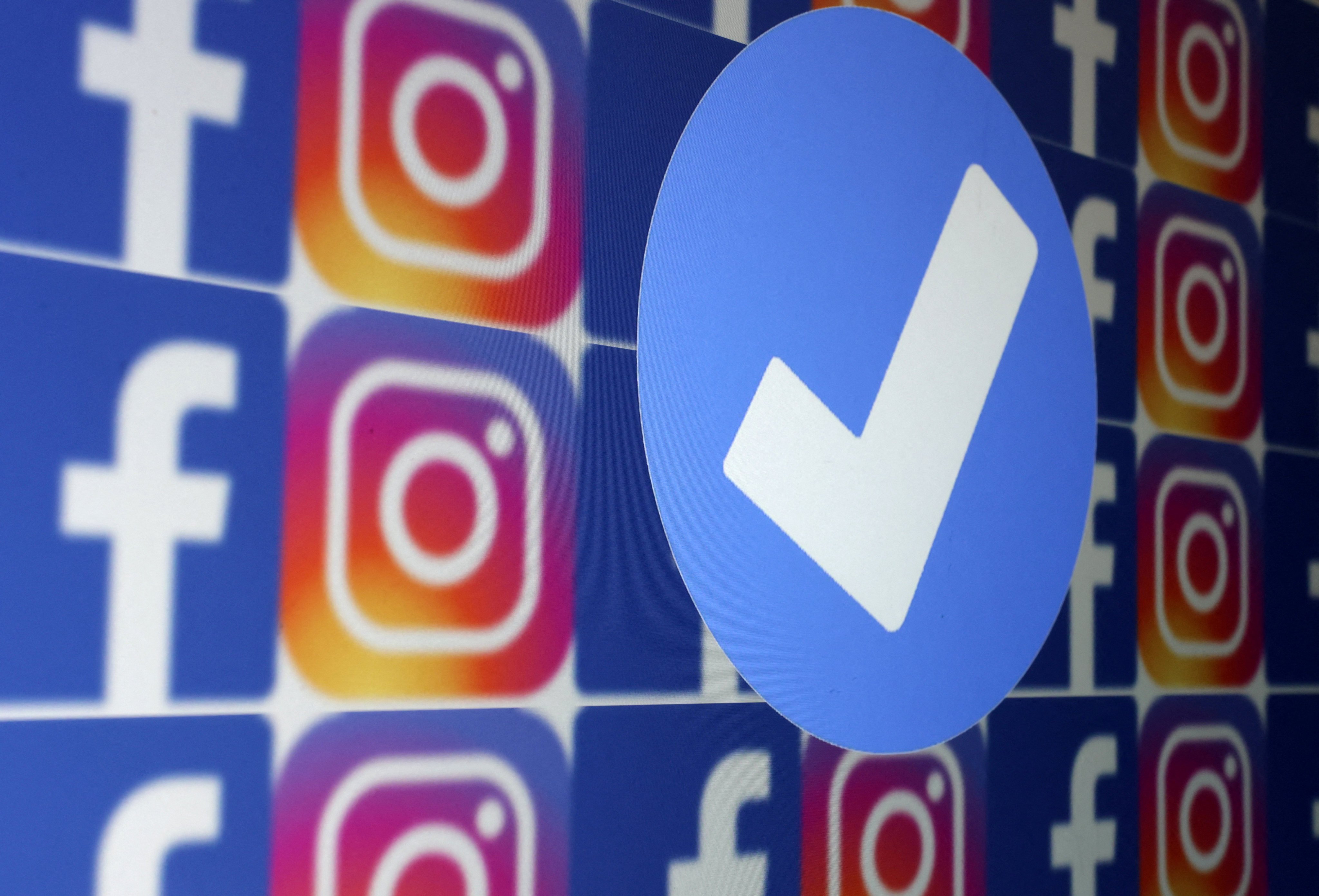 A blue verification badge and the logos of Facebook and Instagram are seen in this picture illustration taken on January 19, 2023. Photo: Reuters