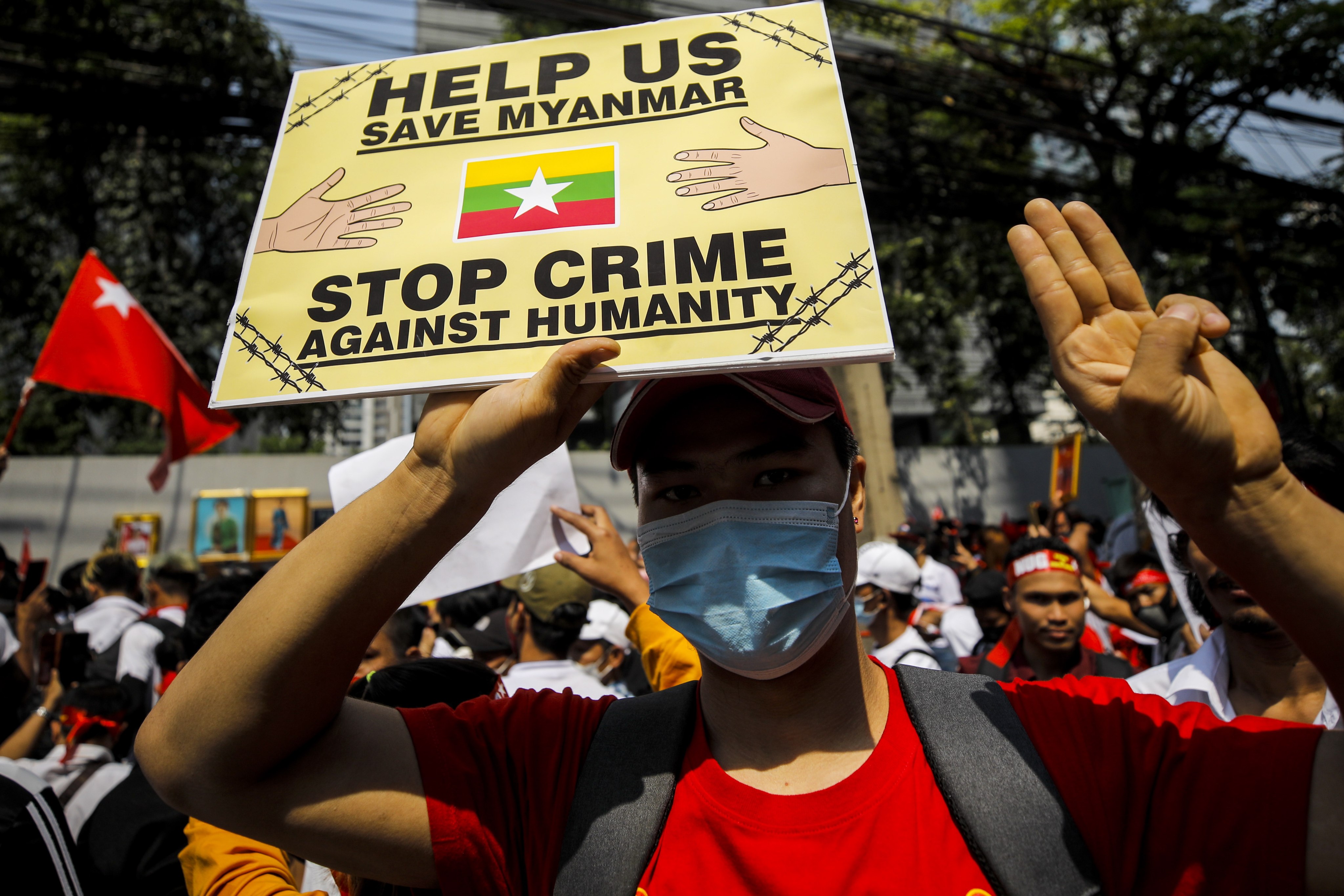 Protesters flash the three-finger salute during a demonstration outside the embassy of Myanmar in Bangkok on February 1, 2023. Photo: EPA-EFE