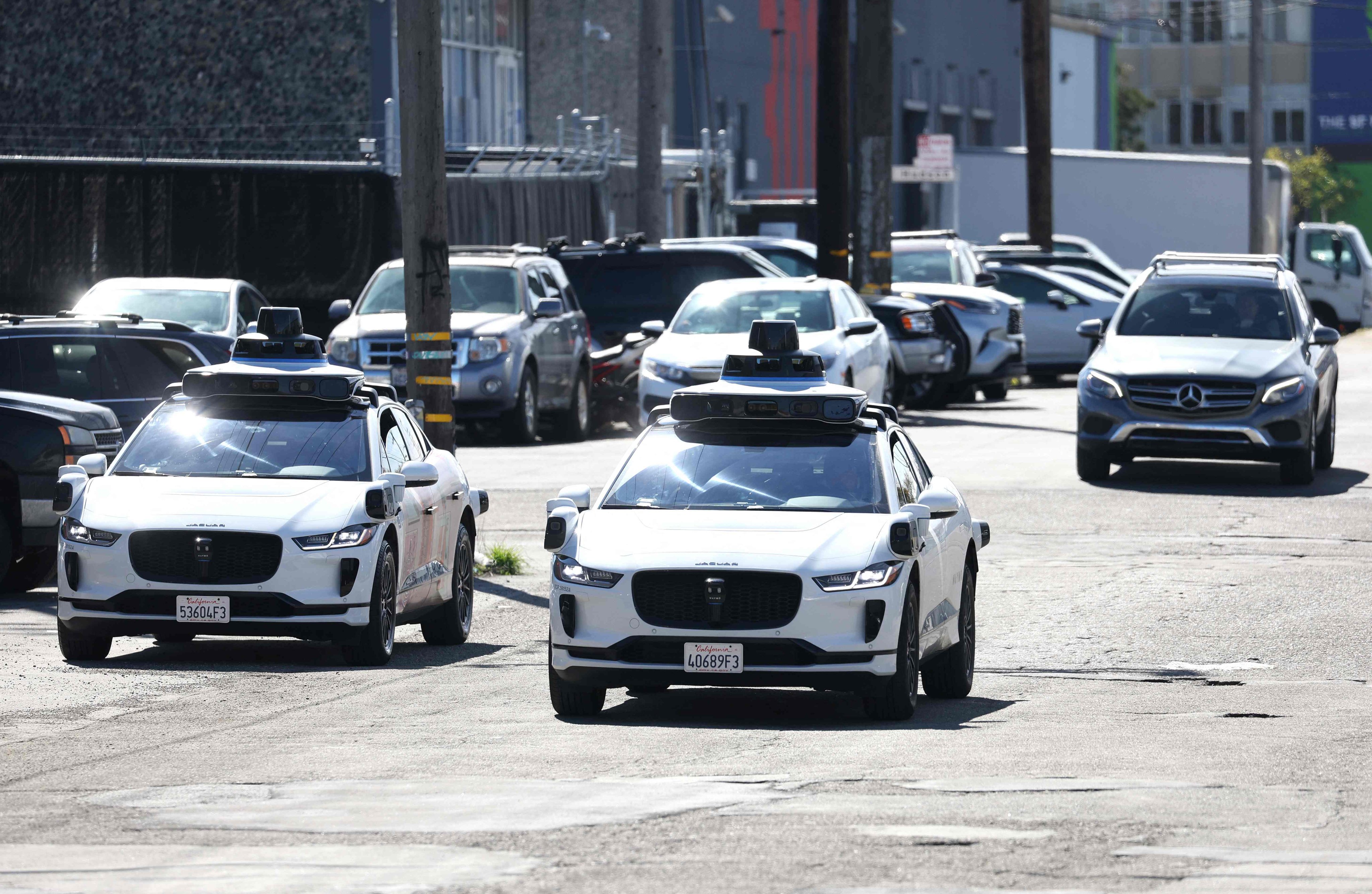 Waymo cars drive down a street in San Francisco, California, on March 1, 2023. Photo: Getty Images via AFP