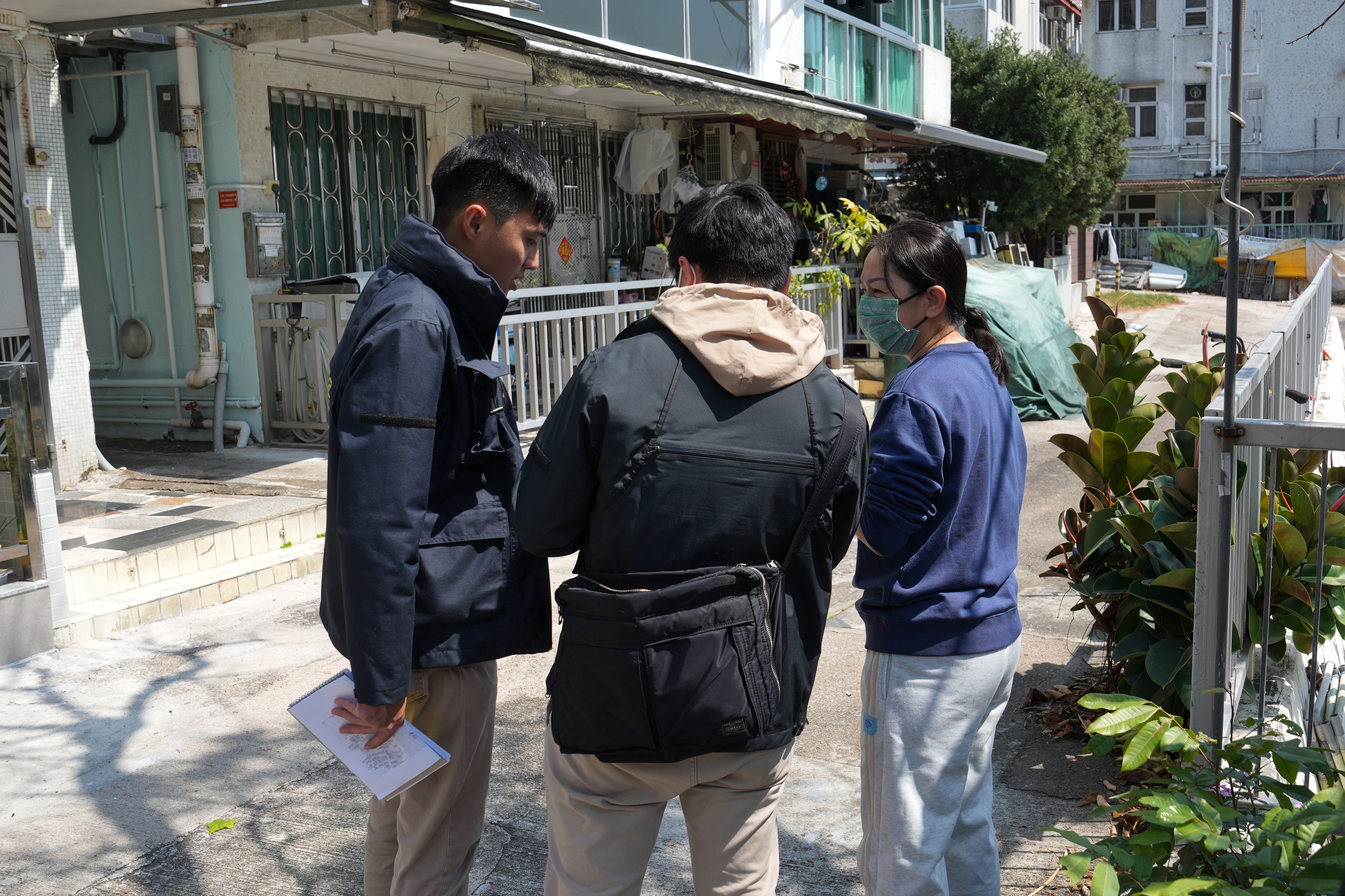 Police officers speak to residents in Lung Mei Tsuen to investigate the murder case of model Abby Choi. Photo: Elson Li