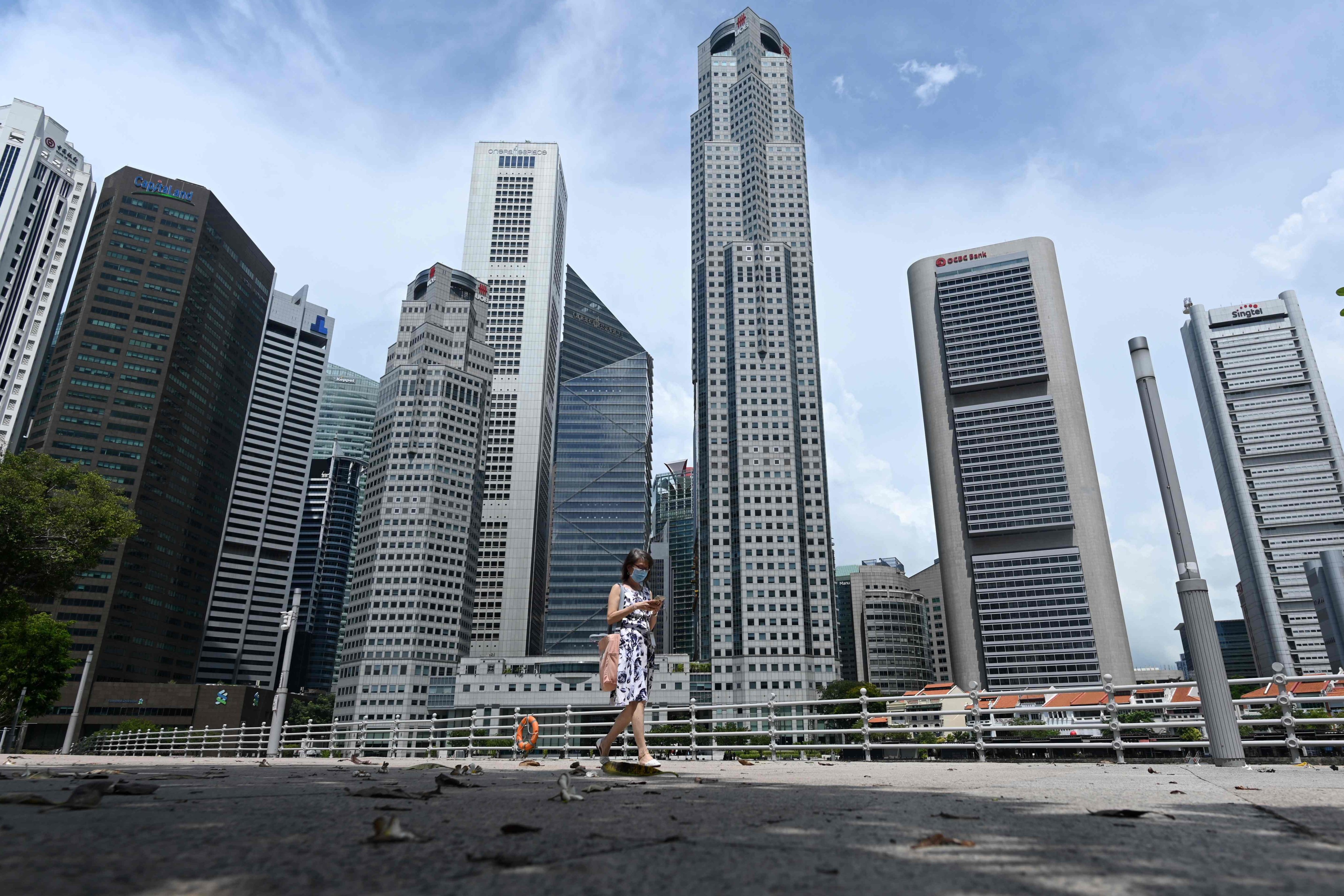 The influx of women into boardrooms shows Singapore is moving in the right direction – but there are still gaps.  Photo: AFP