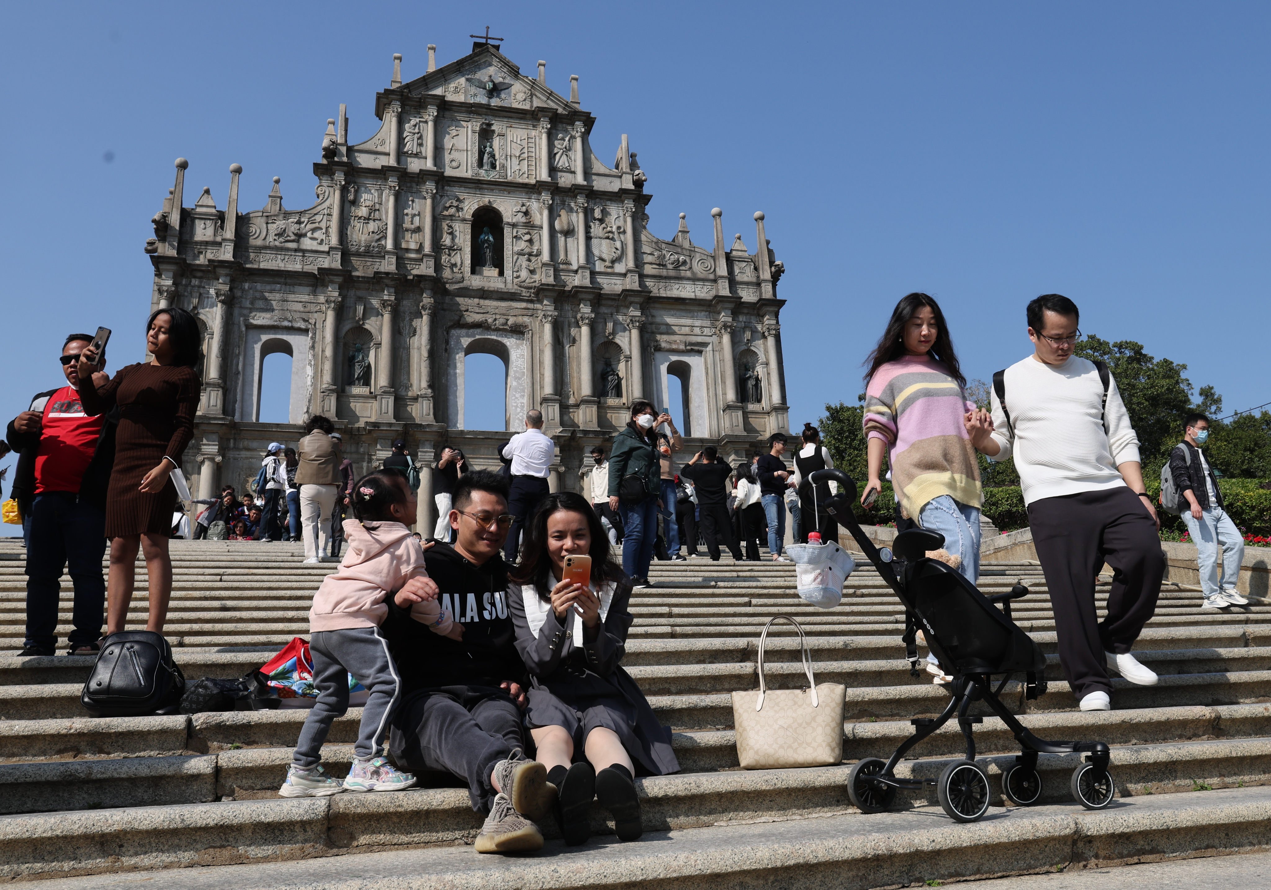 Tourists go mask-free in Macau in February. Photo: Edmond So