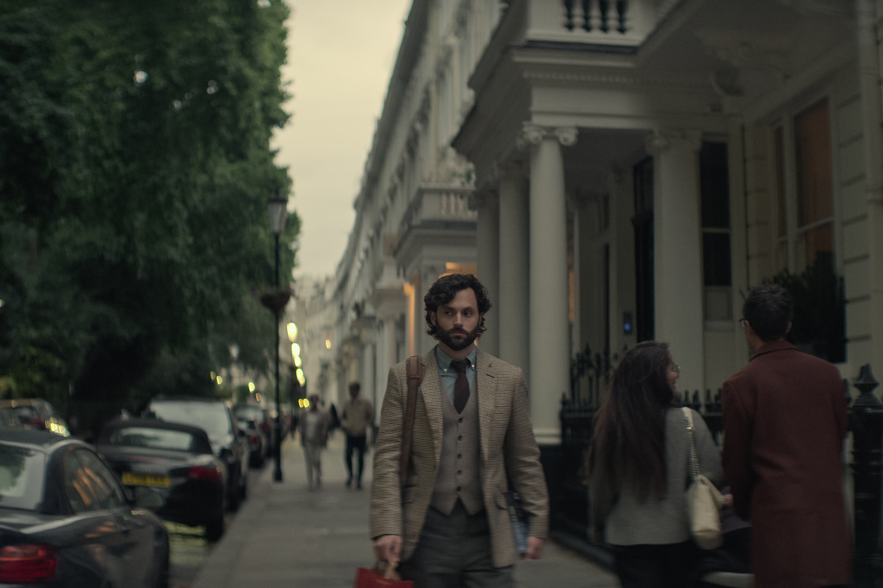 Penn Badgley as Joe Goldberg walks in South Kensington, in London, in season four of Netflix’s You. Photo: Netflix