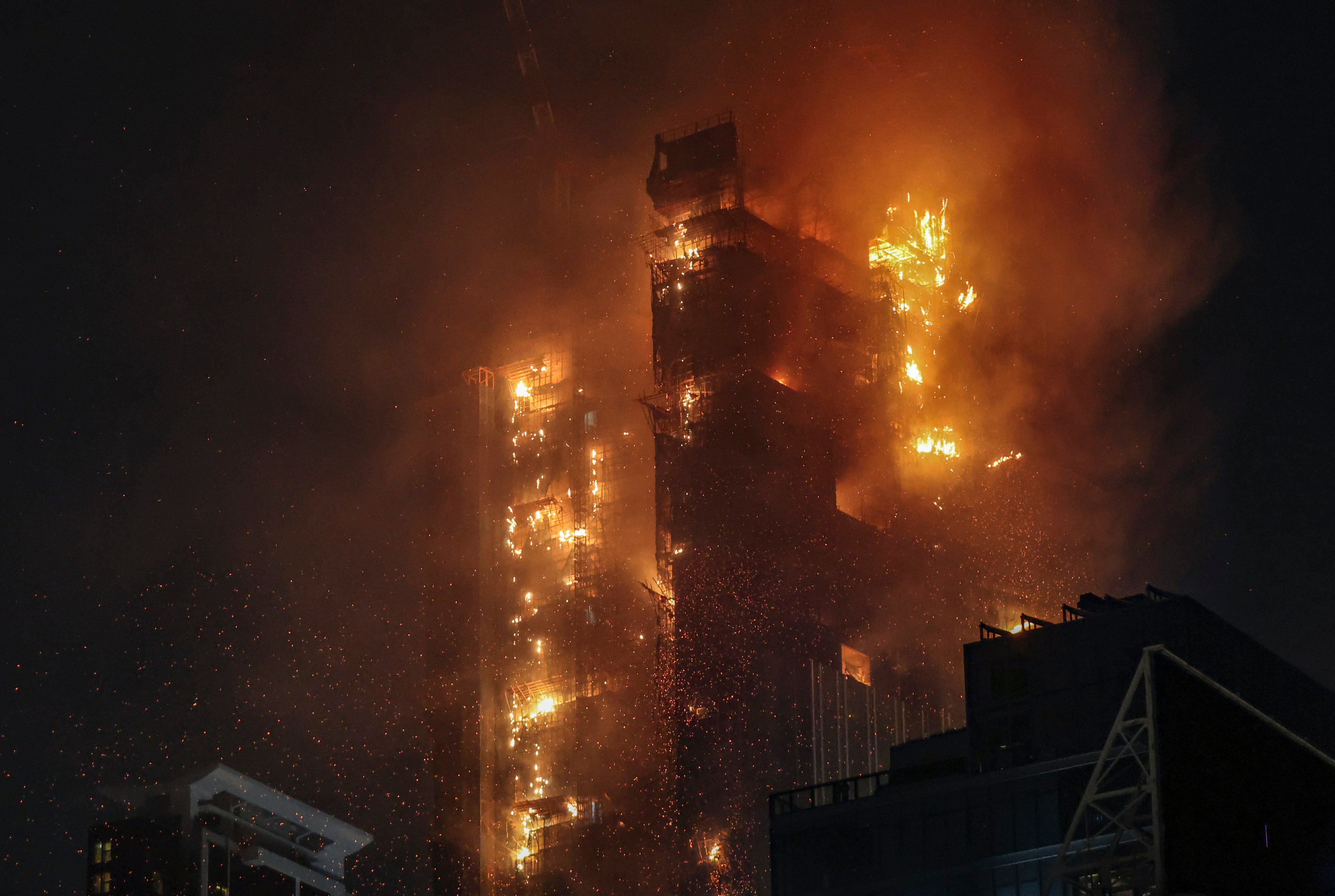 Two people were sent to hospital on Thursday night after a No 4 alarm blaze hit a skyscraper under construction in Hong Kong’s Tsim Sha Tsui district. Photo: Edmond So