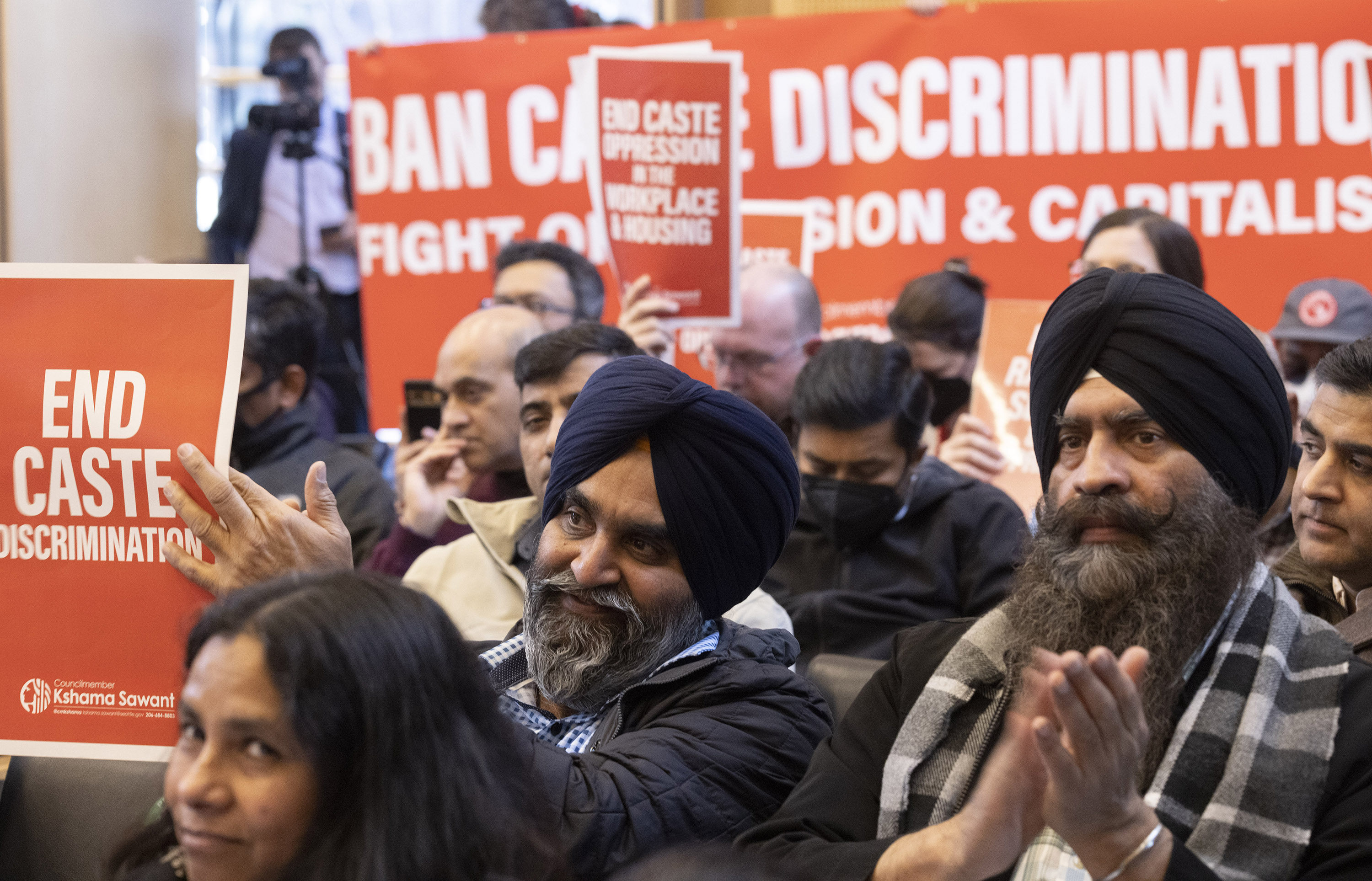 People applaud Seattle banning caste discrimination at a city council meeting last month. Photo: TNS