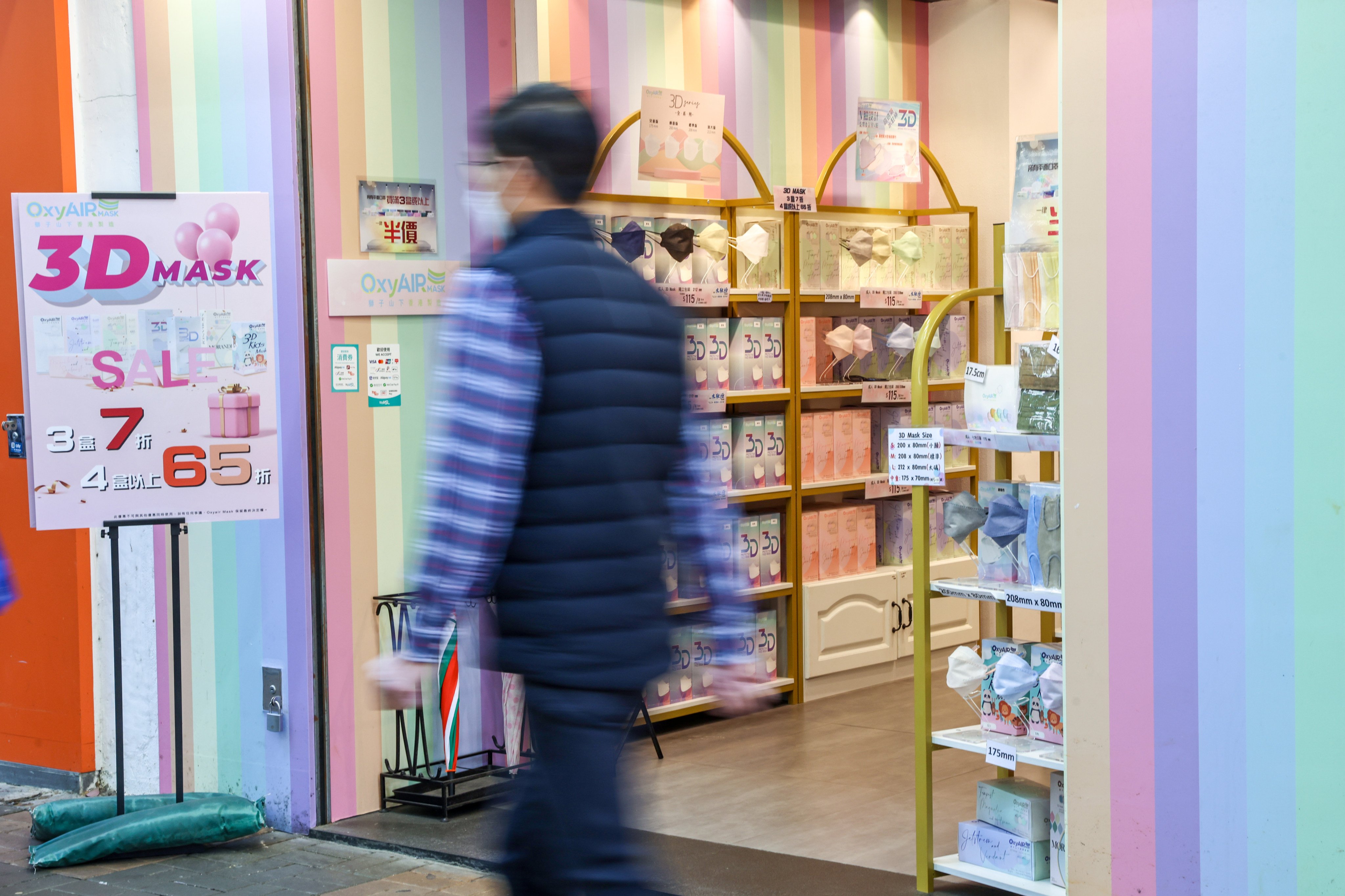 The price of face masks fell, as seen in a shop in Tsim Sha Tsui on February 28, after the government decided to scrap Covid-19 mask rules from March 1, after three years. Photo: K.Y. Cheng