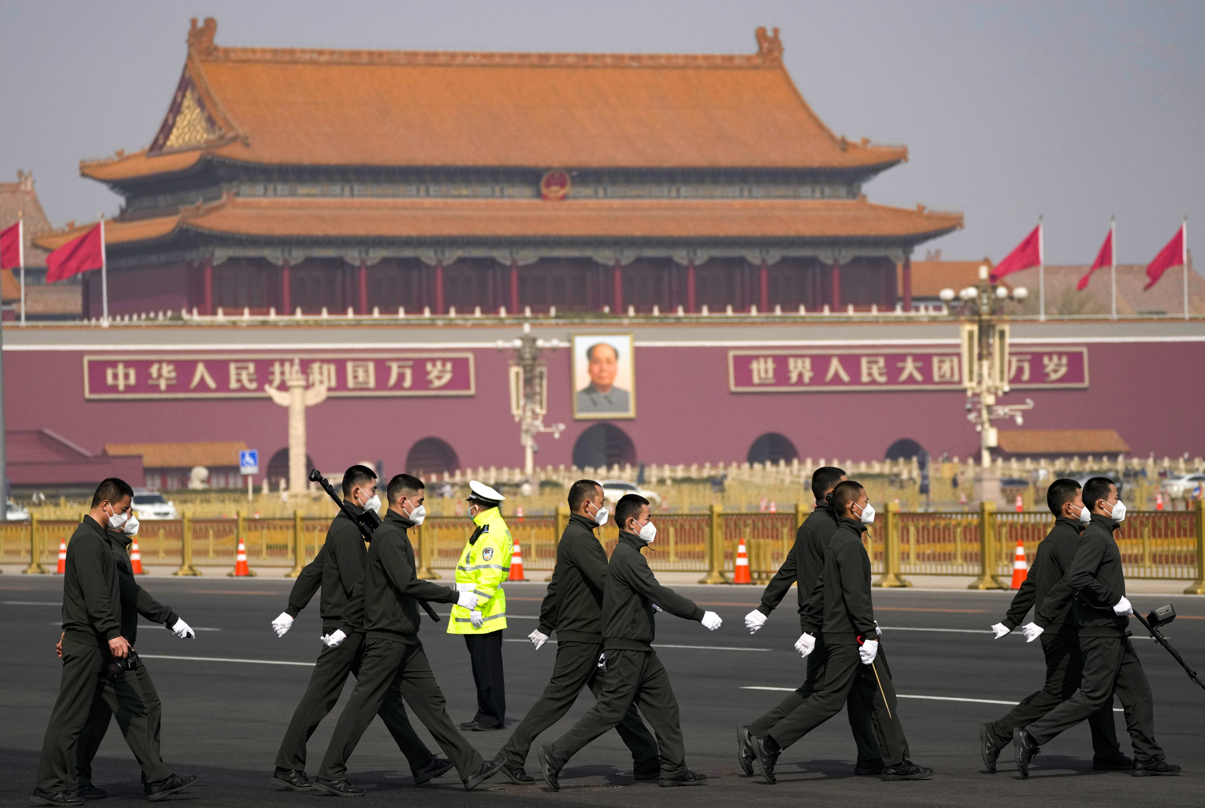 Security staff outside the Great Hall of the People in Beijing. Photo: AP 