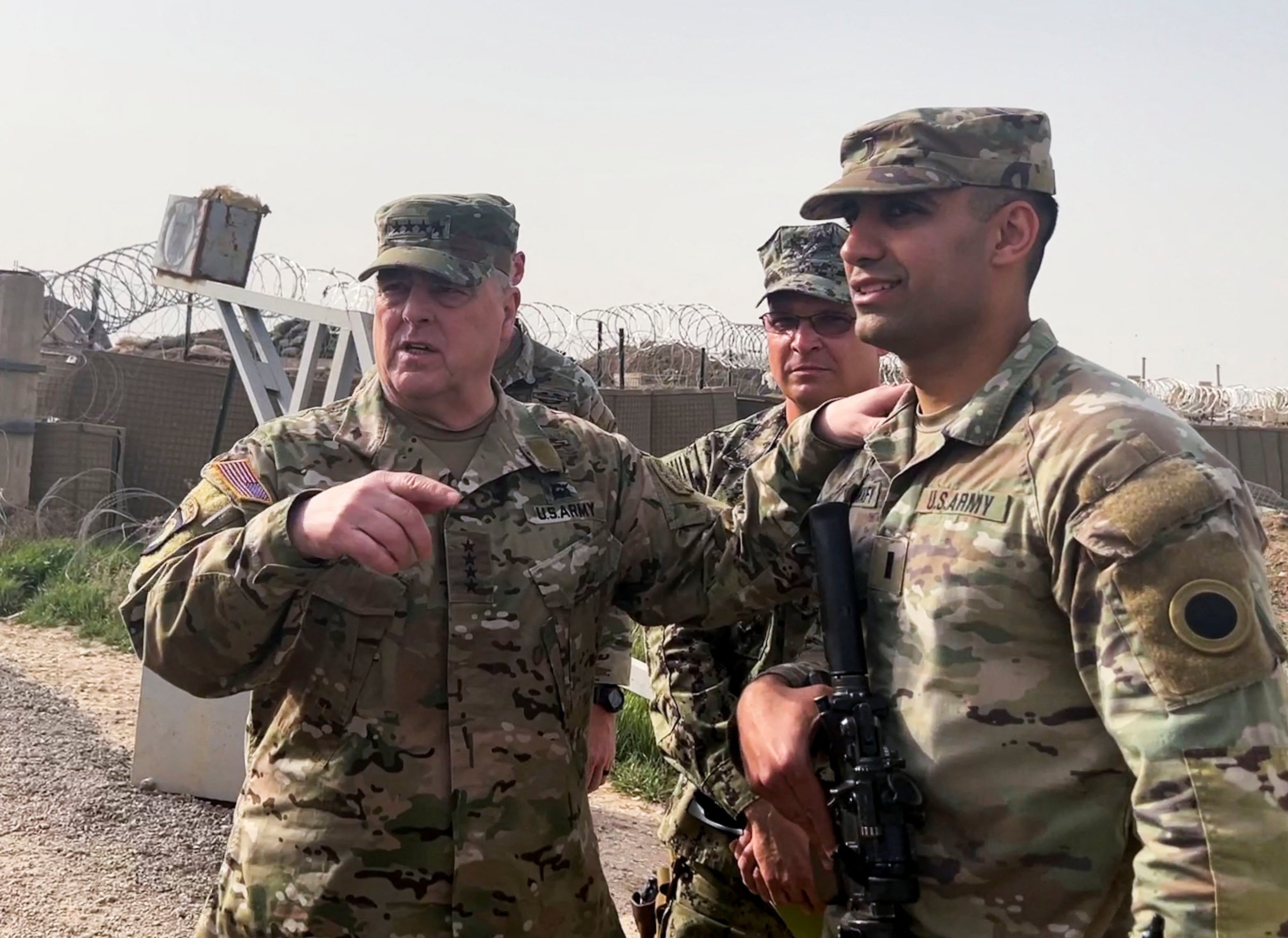 General Mark Milley, left, chairman of the Joint Chiefs of Staff, speaks to US forces in Syria during an unannounced visit at a US military base in northeast Syria on Saturday. Photo: Reuters  